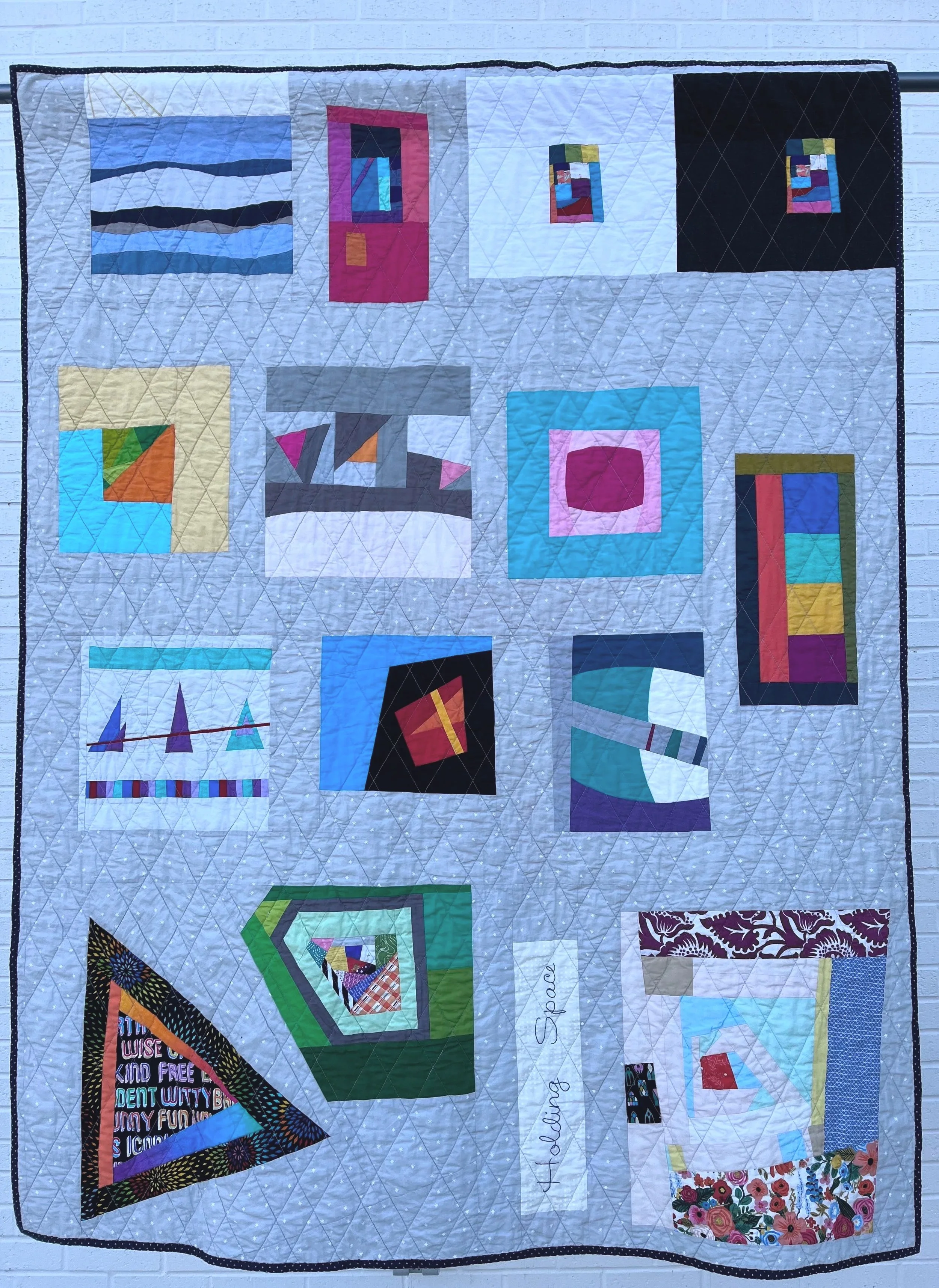 Holding Space
2023
Cotton fabric and batting, polyester thread
53" x 62"

“Holding space” for someone (and that someone can be yourself) is when you are fully present for that person: physically, mentally, emotionally. You create a safe place where t