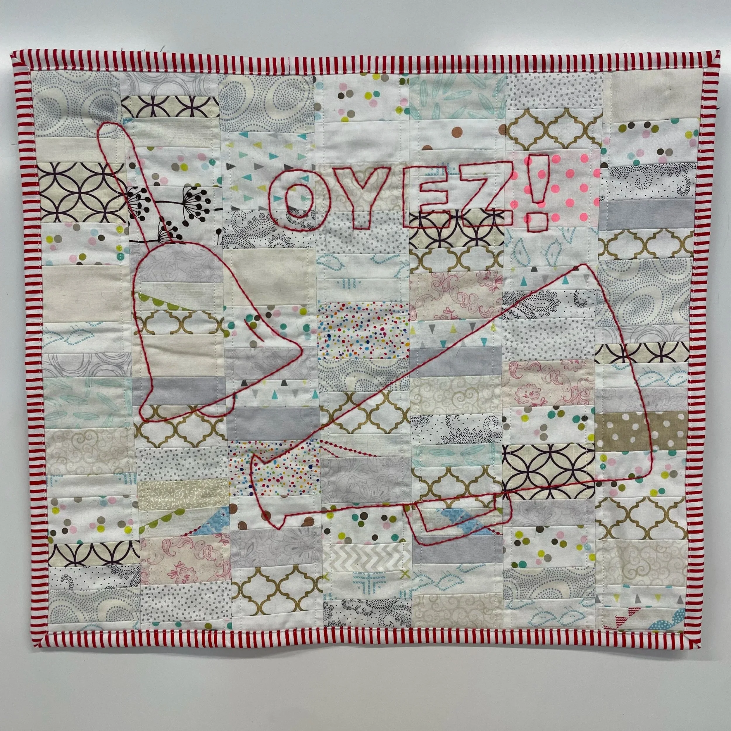 Town Crier
2026
Cotton fabric and batting, polyester thread
14" x 14"