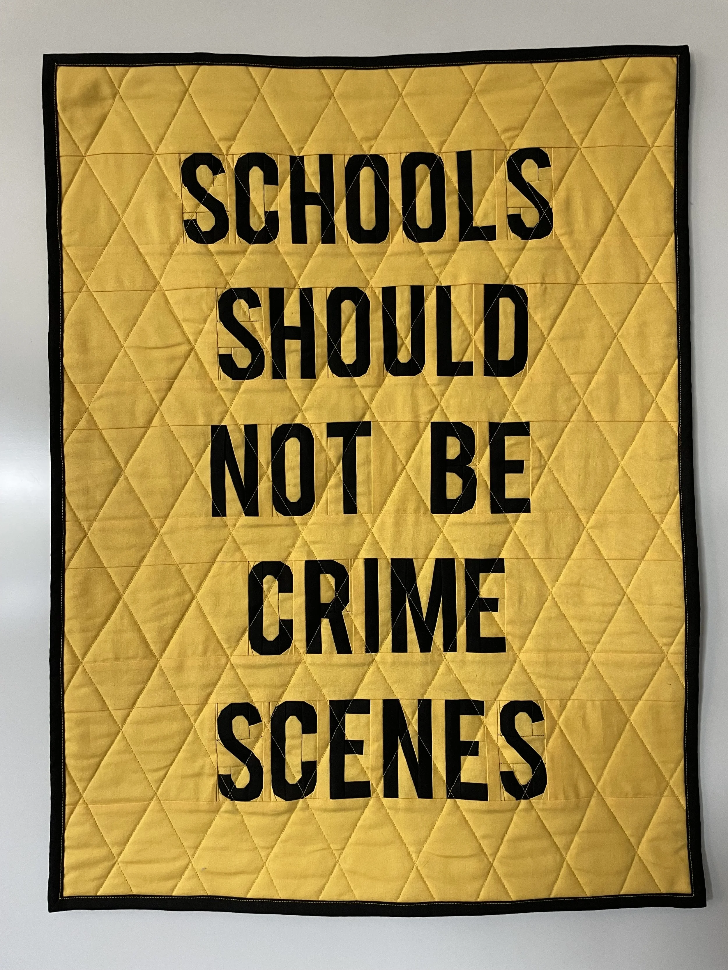 Schools Should Not Be Crime Scenes
2025
Cotton fabric and batting, polyester thread
20.5" x 27.5"

I was sitting at my desk in a large public school and watched the news in real time about an active shooter at another school in my district. I had fri