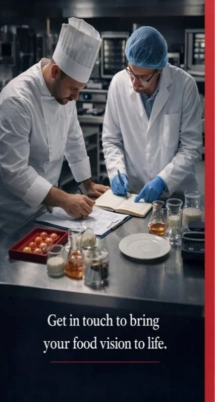 Two chefs in a commercial kitchen, one wearing a chef's hat and the other wearing a blue hairnet and glasses, reviewing notes and testing food samples on a stainless steel countertop with various ingredients and laboratory equipment.