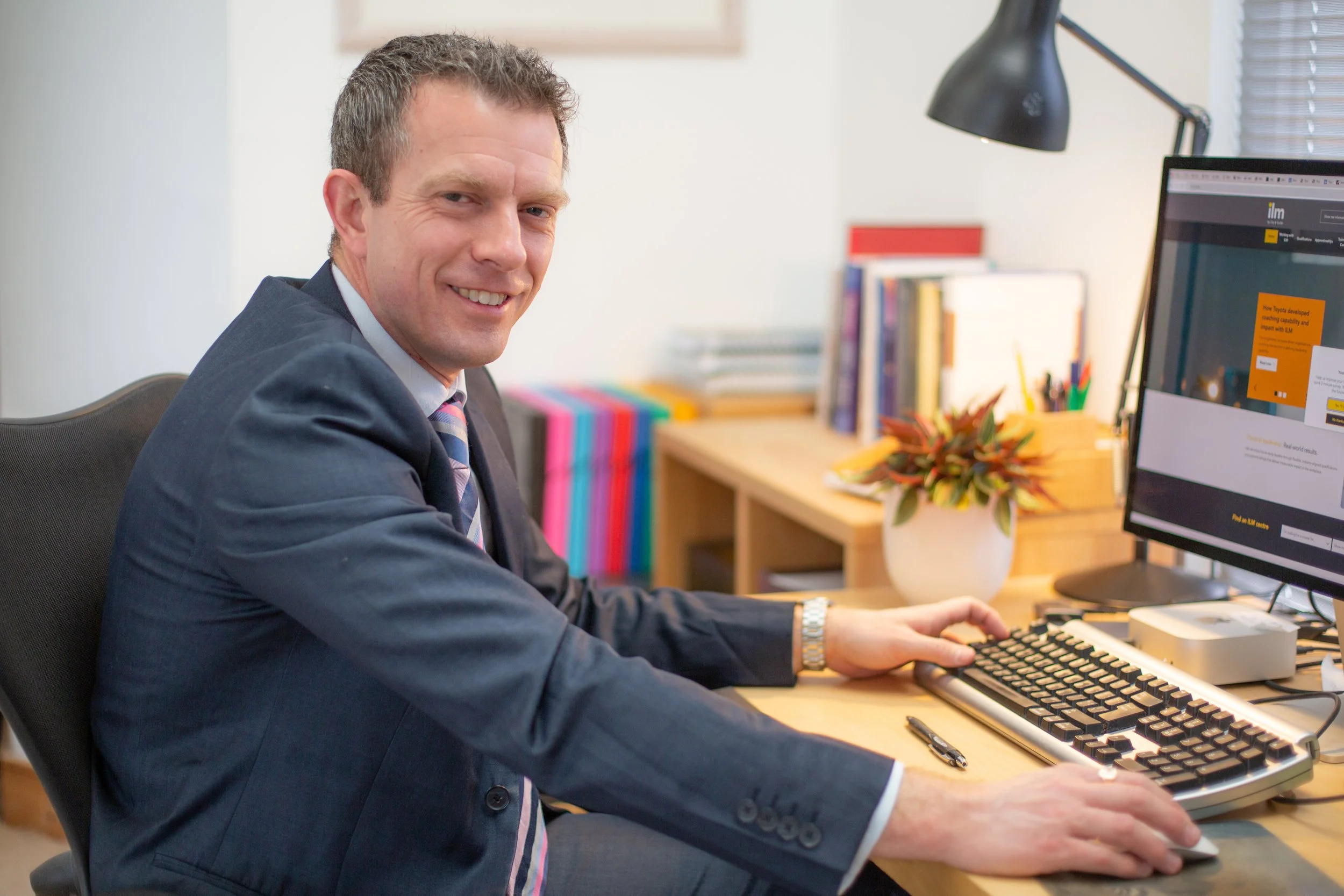 Dr Mike Marriott, Clinical Psychologist (Sat at a computer)