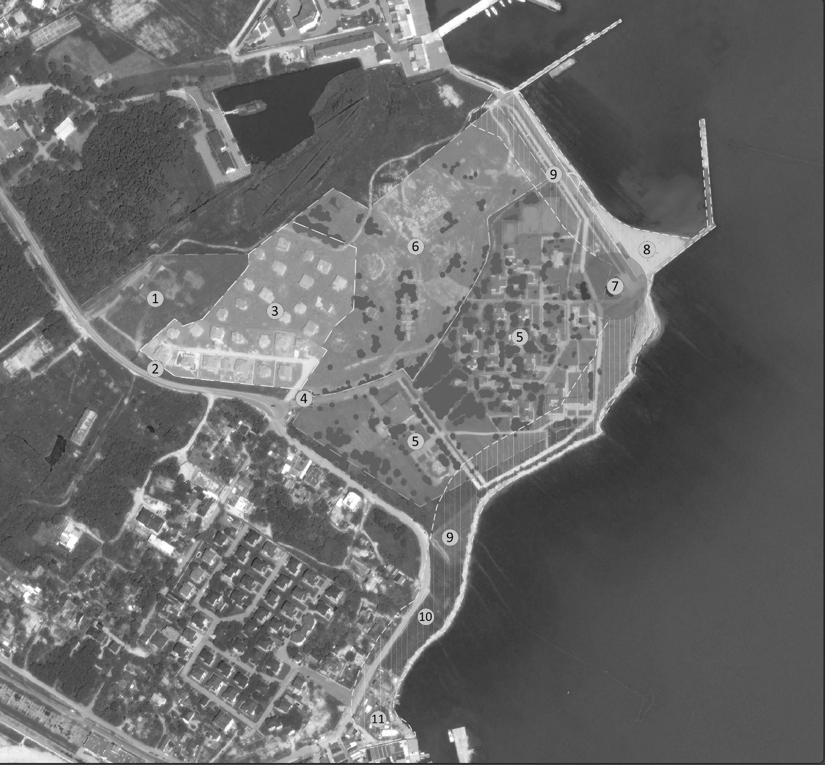 Aerial black and white map showing a coastal area with numbered sections, roads, buildings, trees, water, and a pier extending into the water.