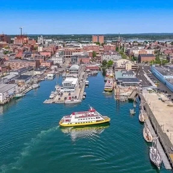 Casco Bay Lines ferry in Portland Maine with the city of Portland skyline