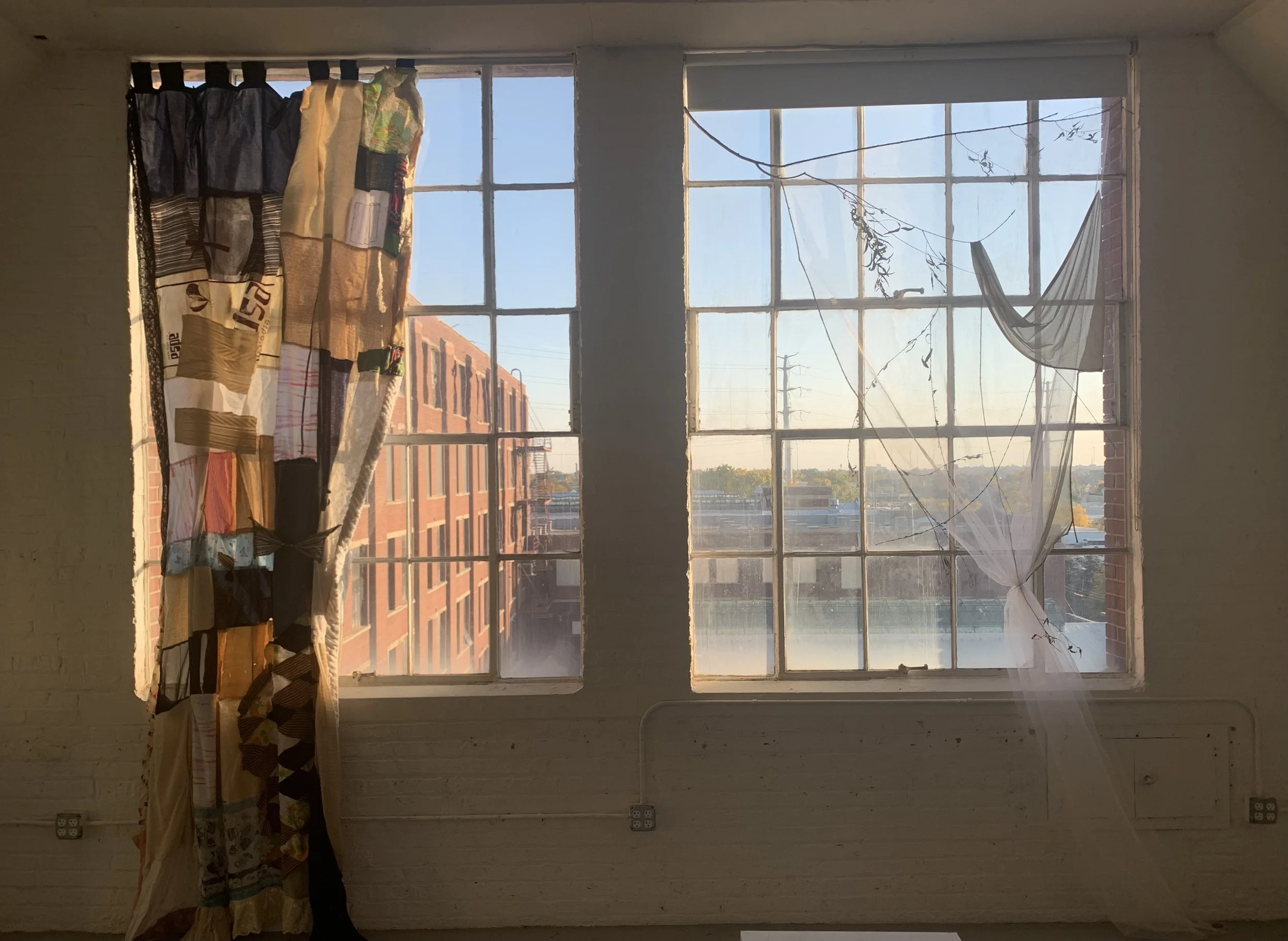 Installation view of Madeline Olson's "Personality Curtain" (LEFT), and Avery Booth's "curtained willow" (RIGHT)
