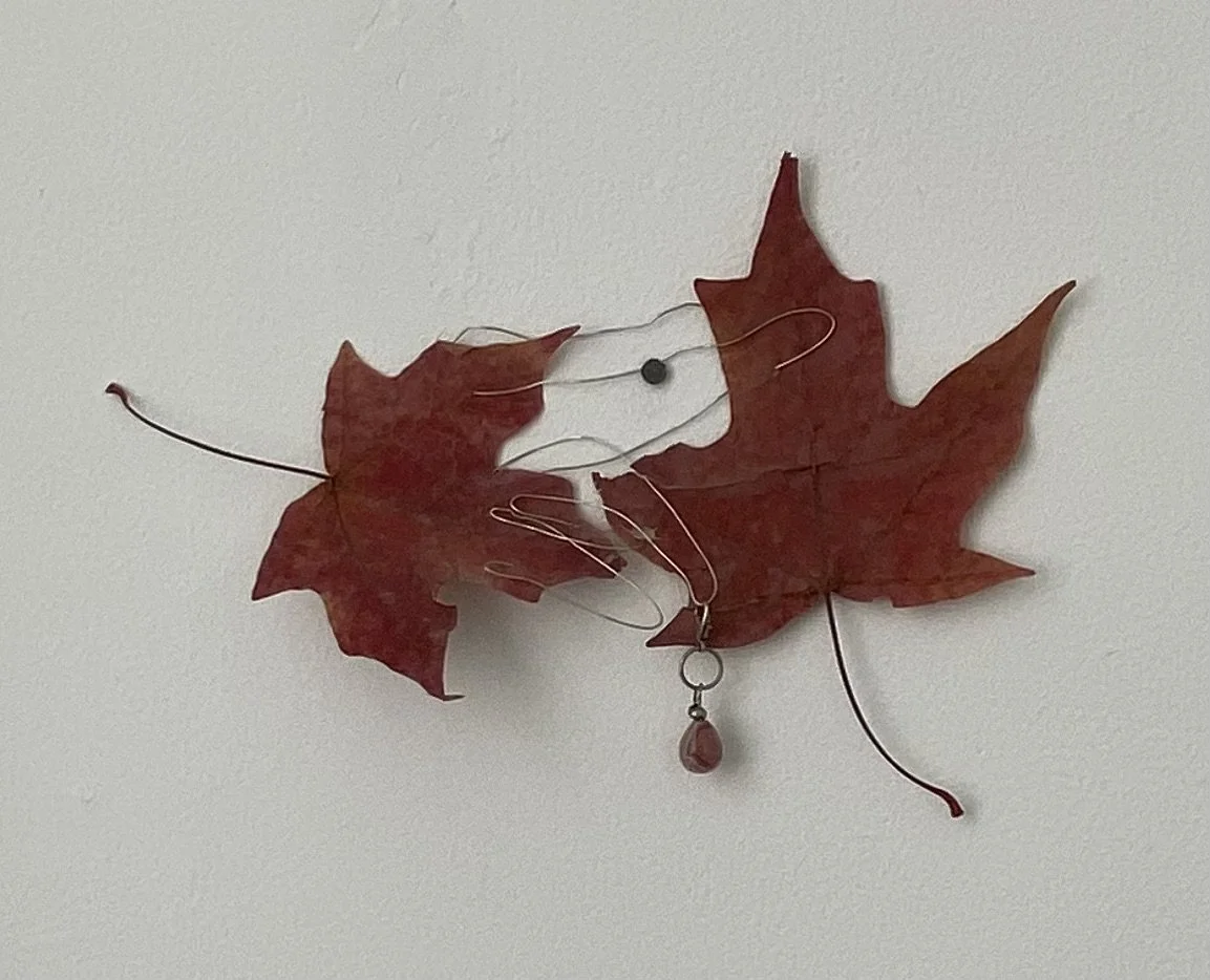 "tumbling swirling twirling" 
/
two leaves, wire, rhodochrosite bead, lobster clasp, tack, jump ring, a whim, silver seed bead
/
Dimensions Variable
/
(2021)