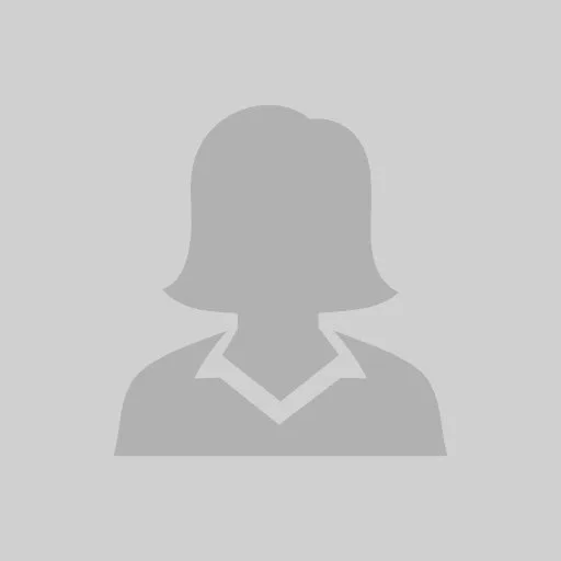 Silhouette of a person with short hair and blazer, facing forward.