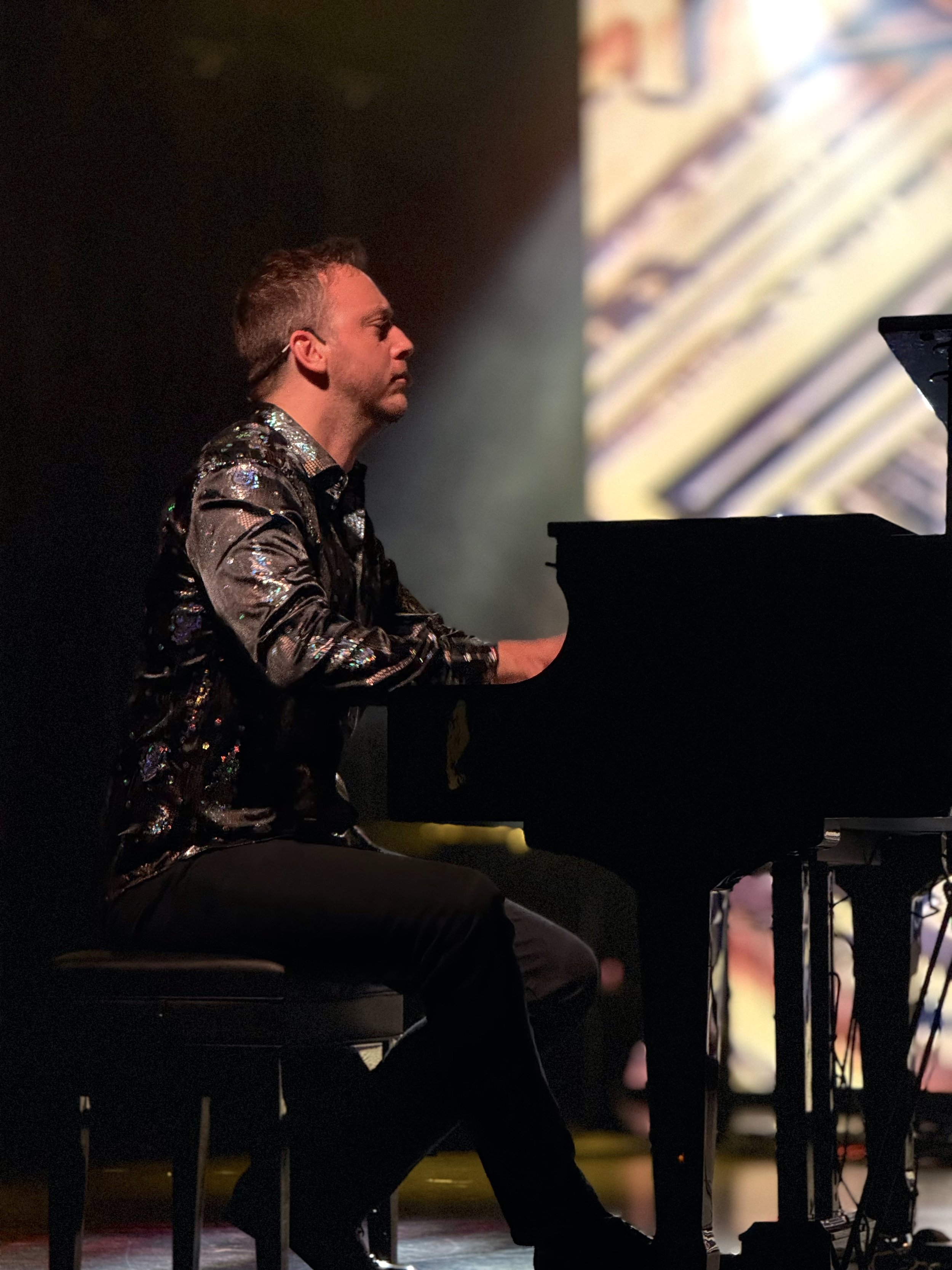 Reuel performing a piano show in Austin, Texas