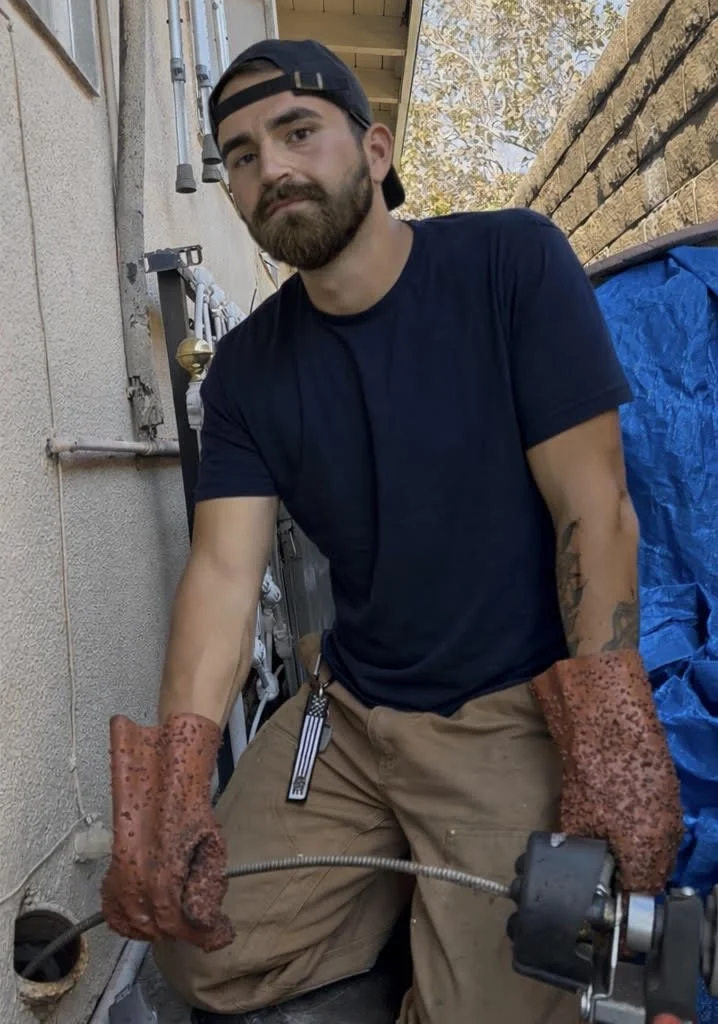 Drain Cleaning using a drain snake at exterior cleanout in Costa Mesa, CA