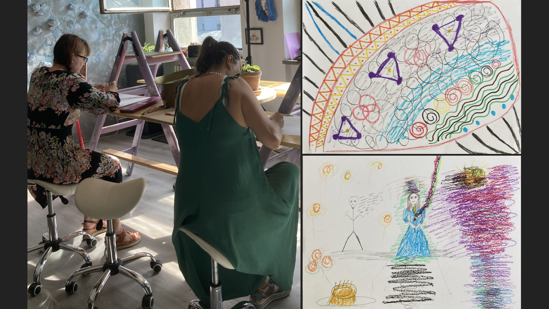 Two women sit at a wooden table, engaged in drawing or writing, in a room with natural light from a window. One woman wears a black floral dress, and the other wears a green dress. On the right side of the image, there are two colorful children's drawings, one featuring a rainbow-like arc and shapes, and the other depicting a stick figure and a girl with a blue dress holding a green object, with various colorful scribbles.
