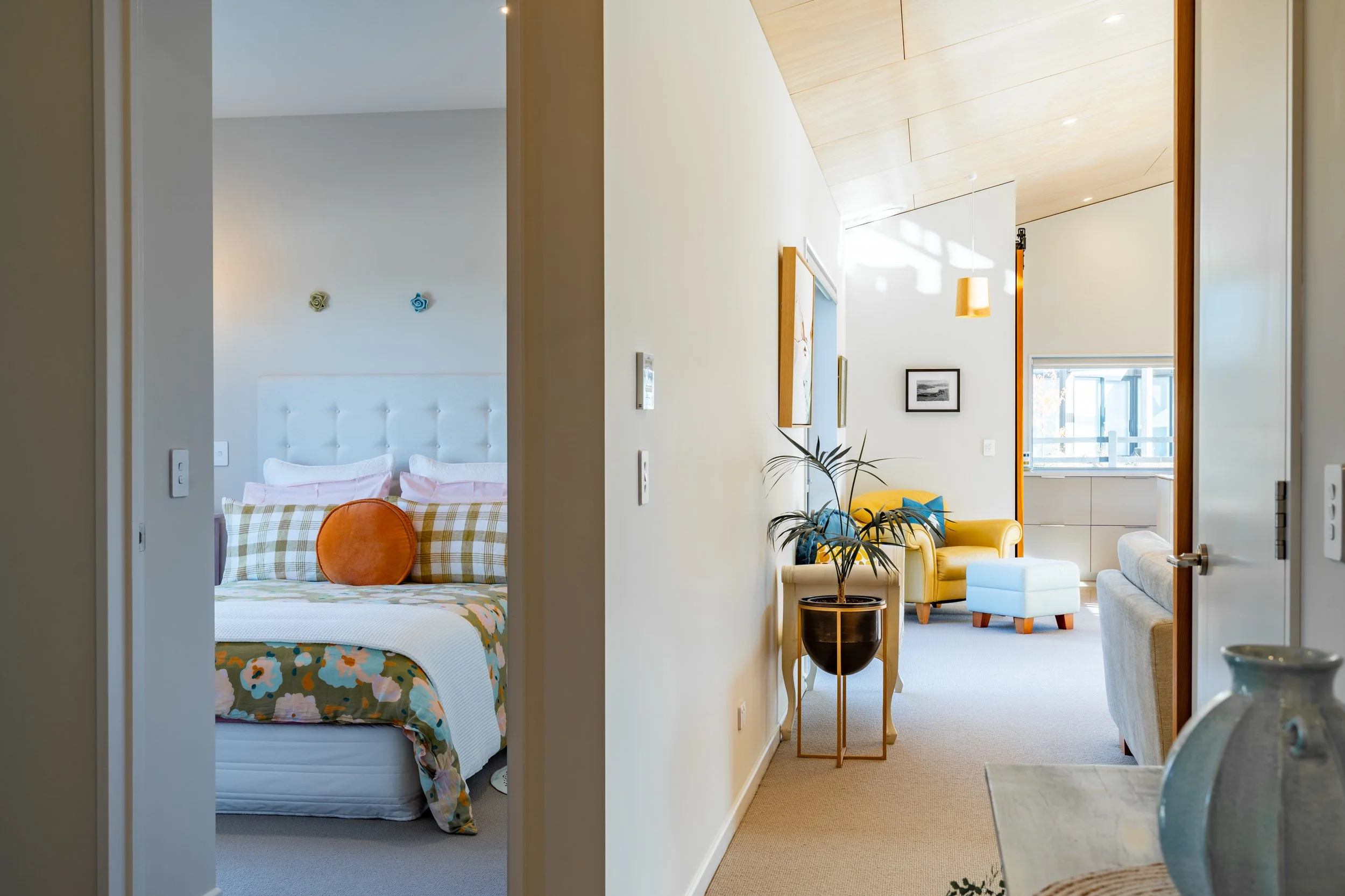 Interior of modern airtight home with natural light and layered living spaces.