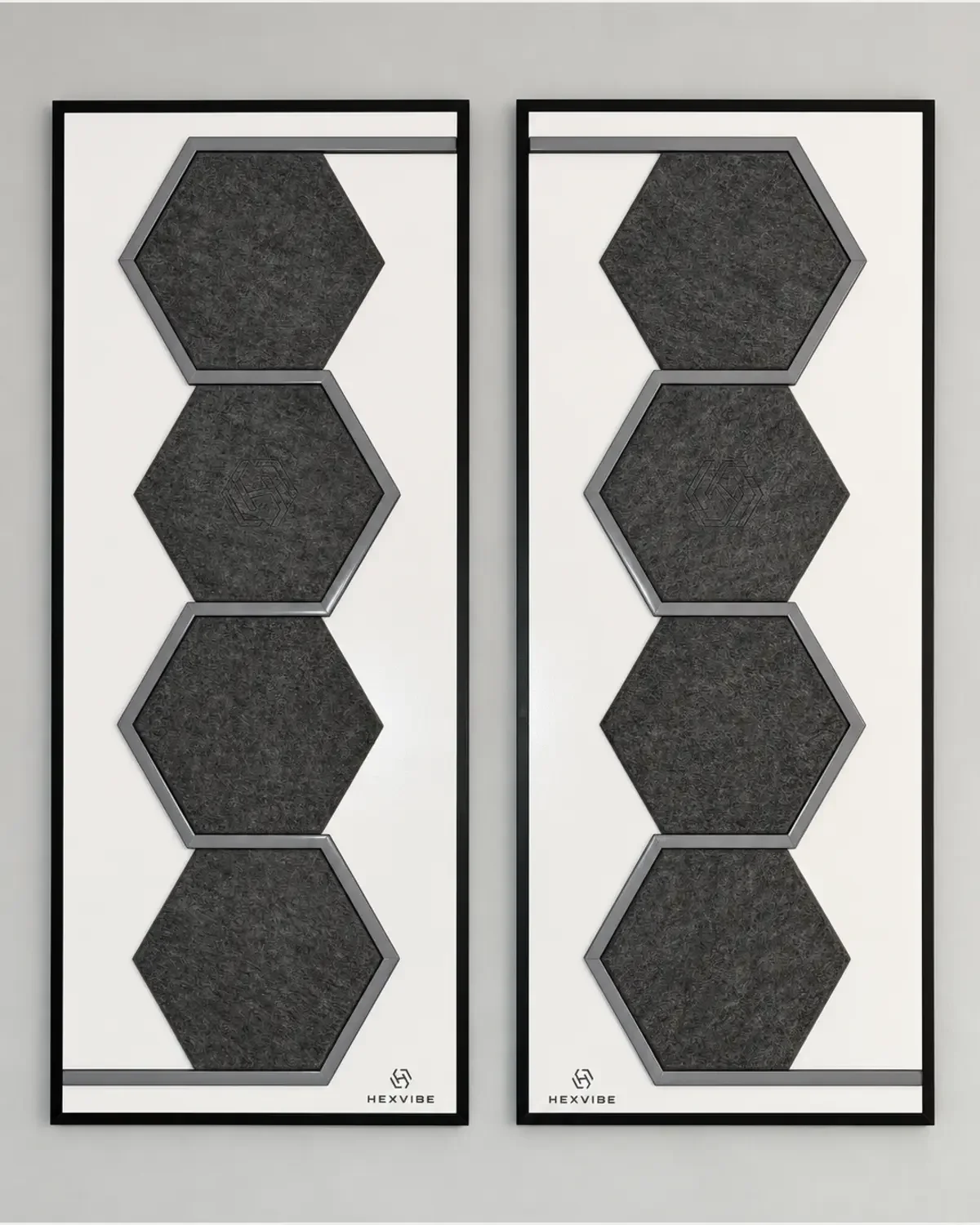 Two unlit HexVIBE FLOW Slate sound-reactive LED acoustic wall panels arranged as a mirrored pair, each featuring four hexagons