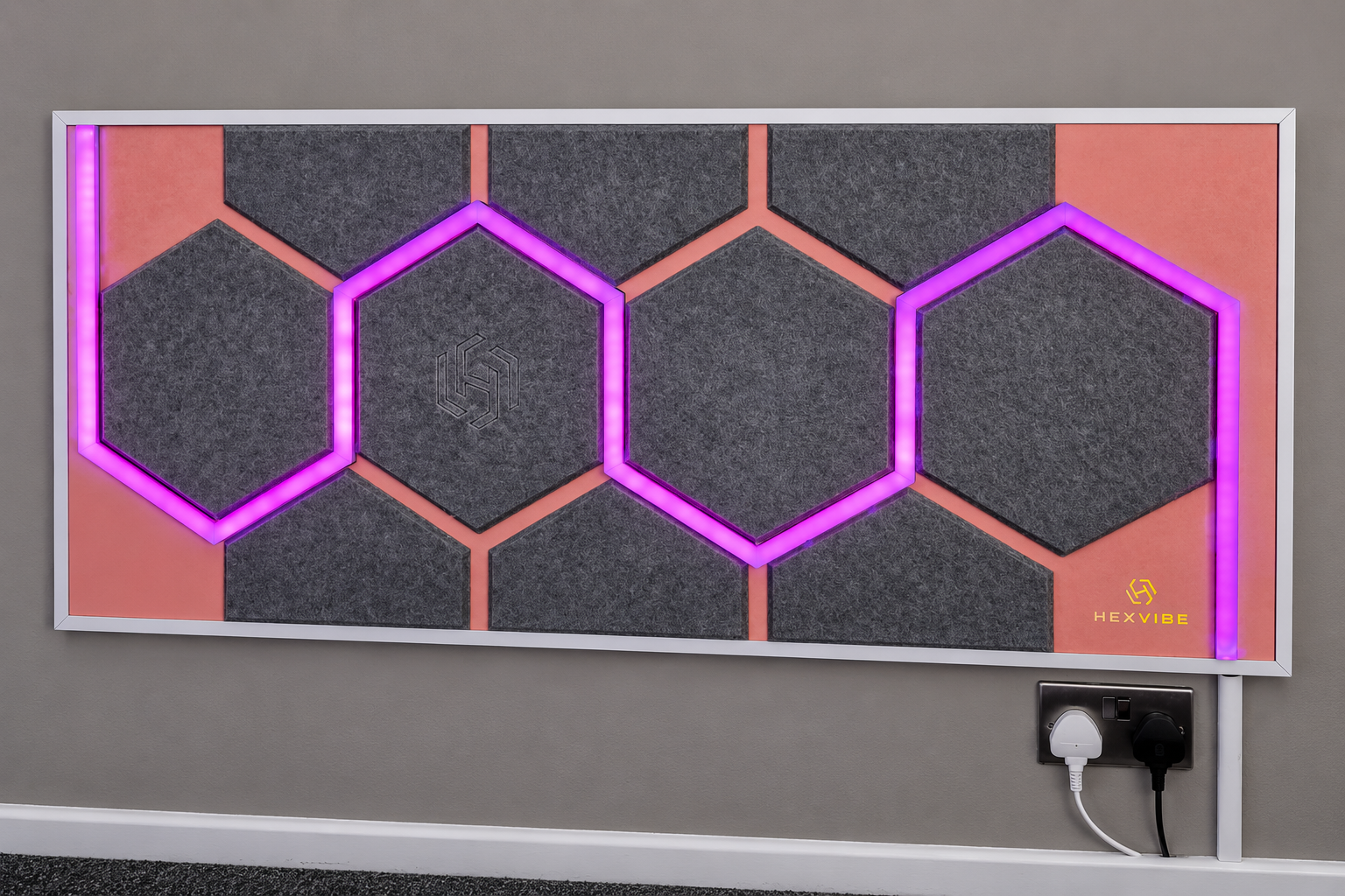 Bespoke HexVIBE acoustic wall panel with custom hexagonal design and integrated purple LED lighting