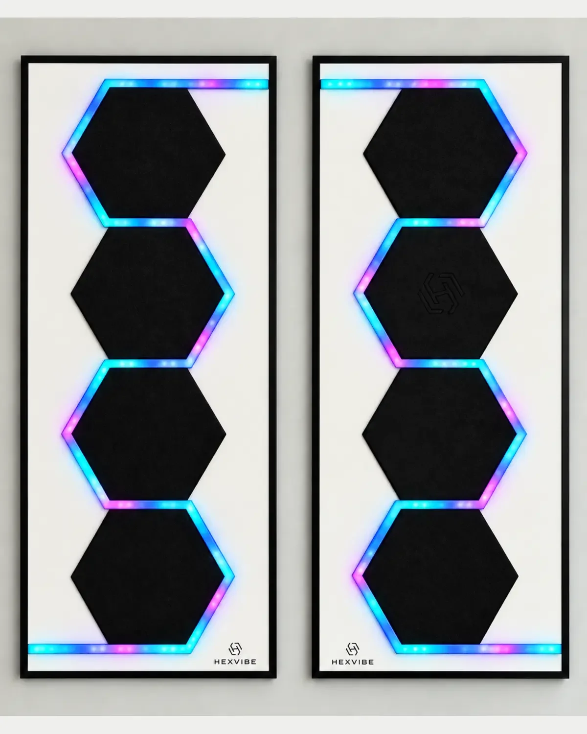 Two illuminated HexVIBE FLOW Onyx sound-reactive LED acoustic wall panels arranged as a mirrored pair with blue, cyan and magenta lighting