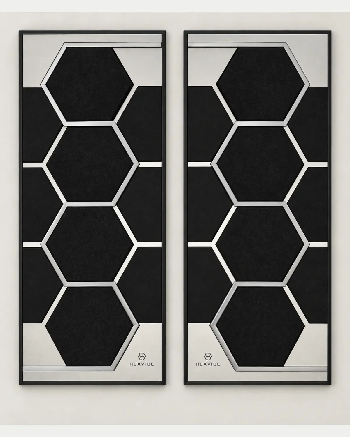 Two unlit HexVIBE FLOW Titanium acoustic LED panels arranged as a mirrored pair with optional side infill