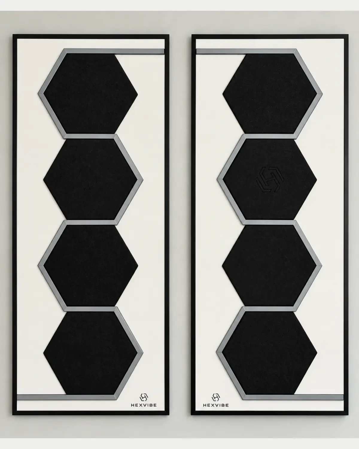 Two unlit HexVIBE FLOW Onyx sound-reactive LED acoustic wall panels arranged as a mirrored pair, each featuring four hexagons