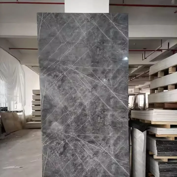 A large, polished gray marble tile with white veining in a warehouse.