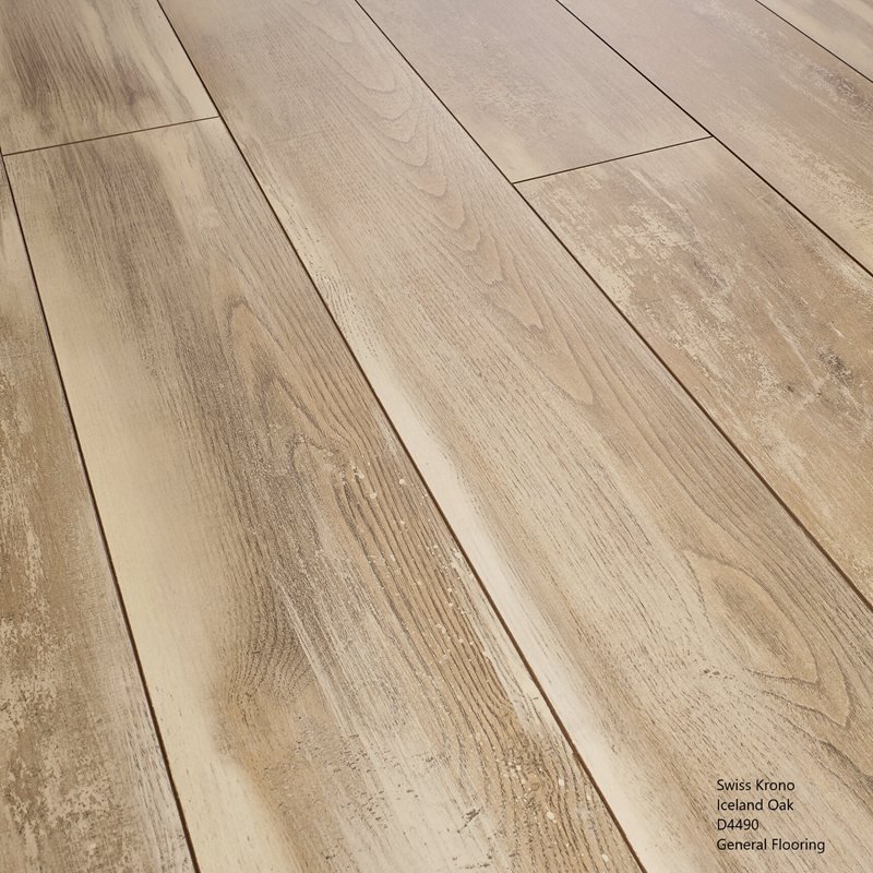 A close-up view of light-colored wood flooring planks arranged in parallel, showing wood grain patterns and a matte finish.