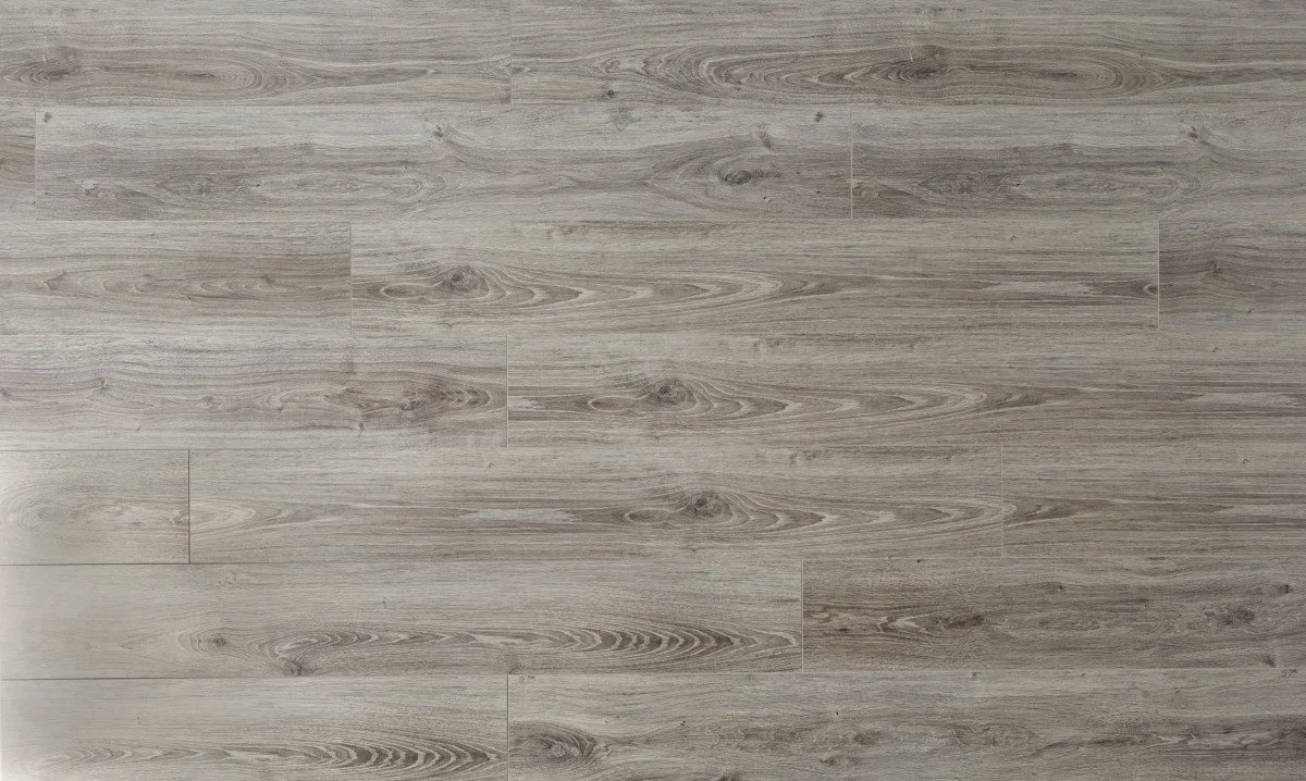 Wooden floor with light gray and beige tones, showing a natural wood grain pattern.