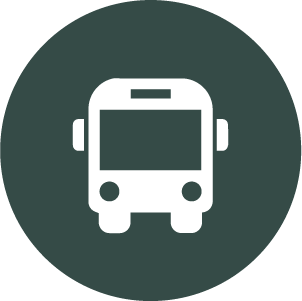 Icon of a bus on a dark green circular background
