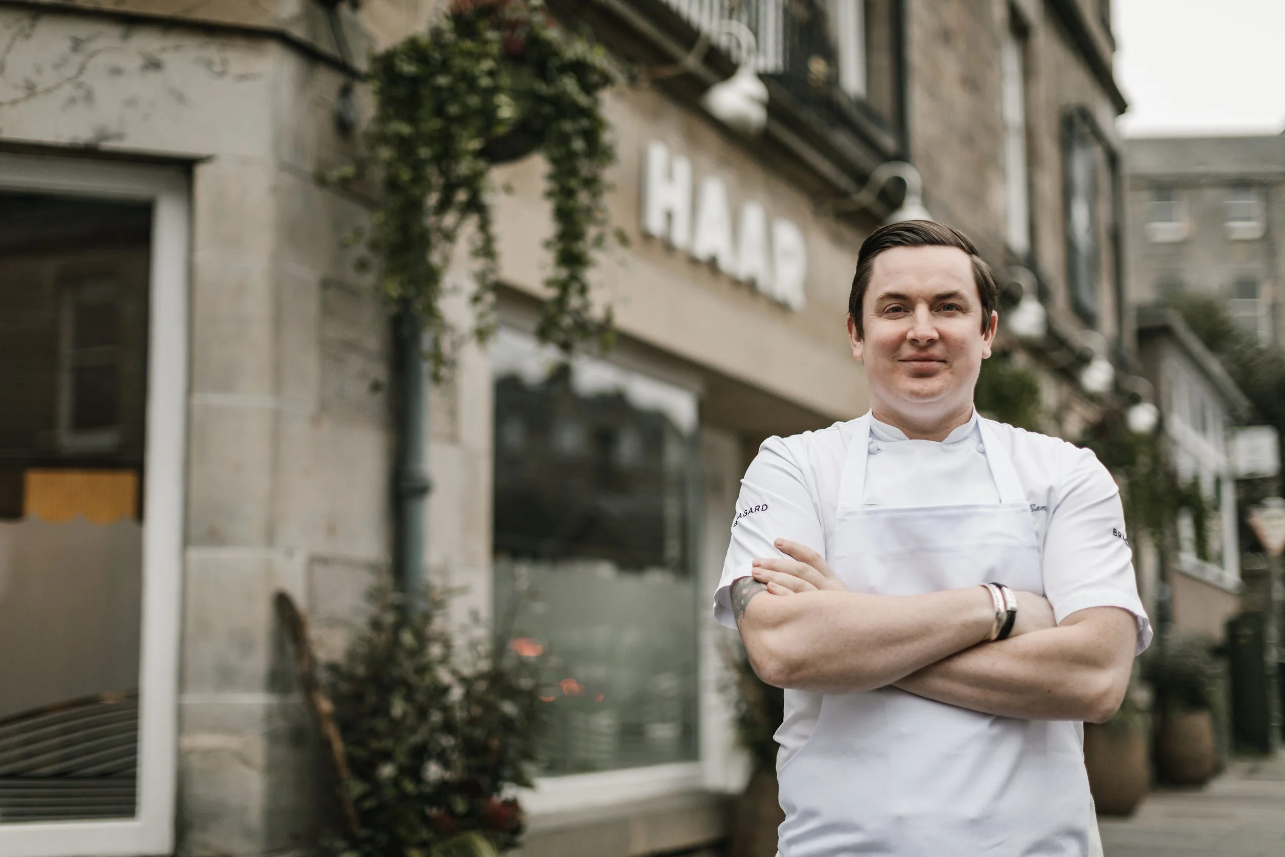 Chef Dean Banks standing outside Haar Restaurant in St. Andrews