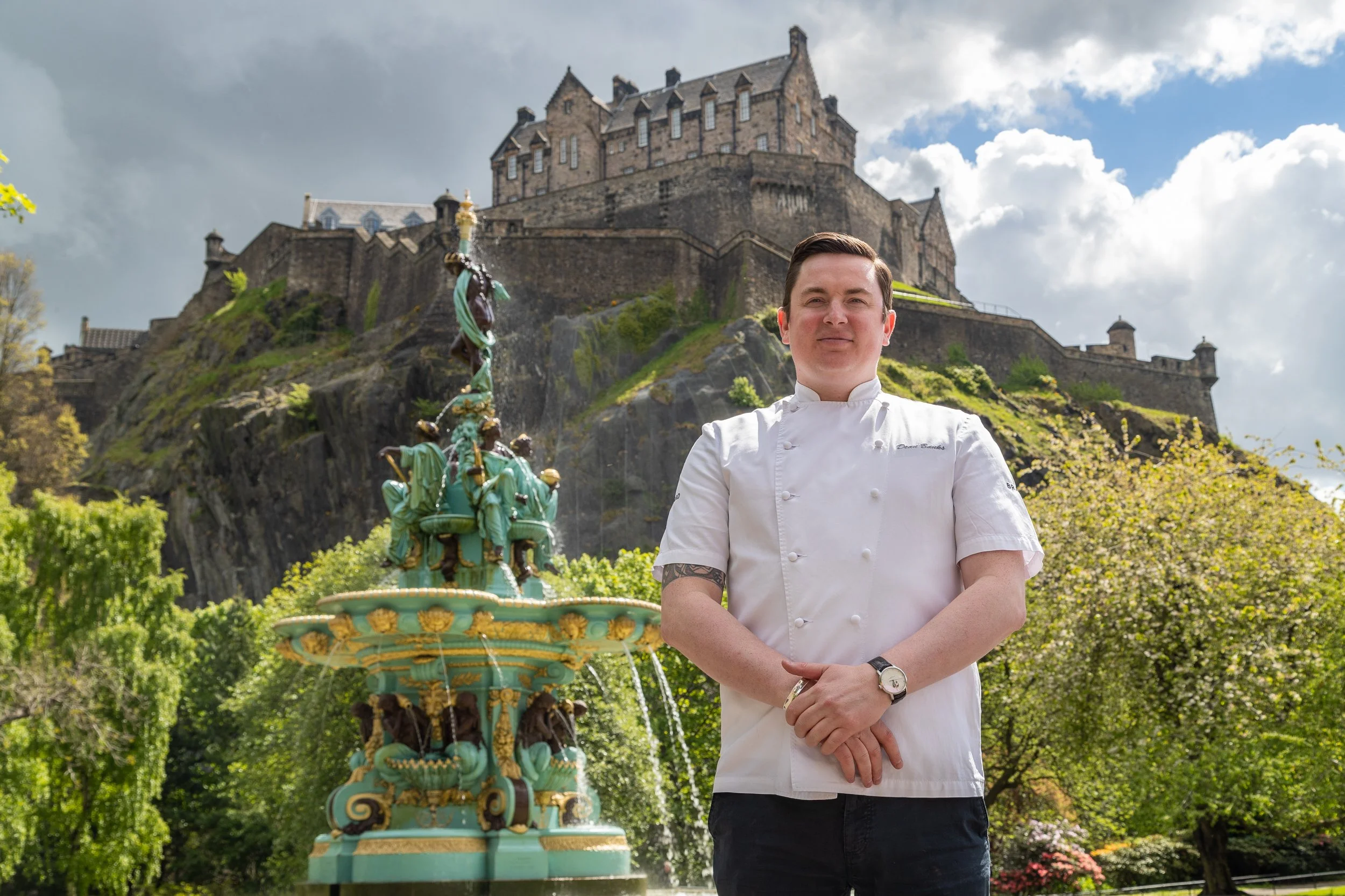 Chef Dean Banks standing in front of Edinburgh Castle