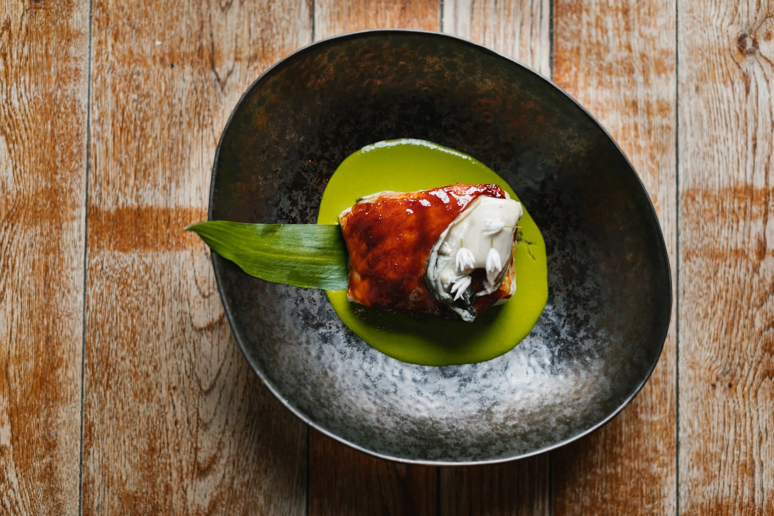 miso-baked cod with Scottish oyster and wild garlic sauce