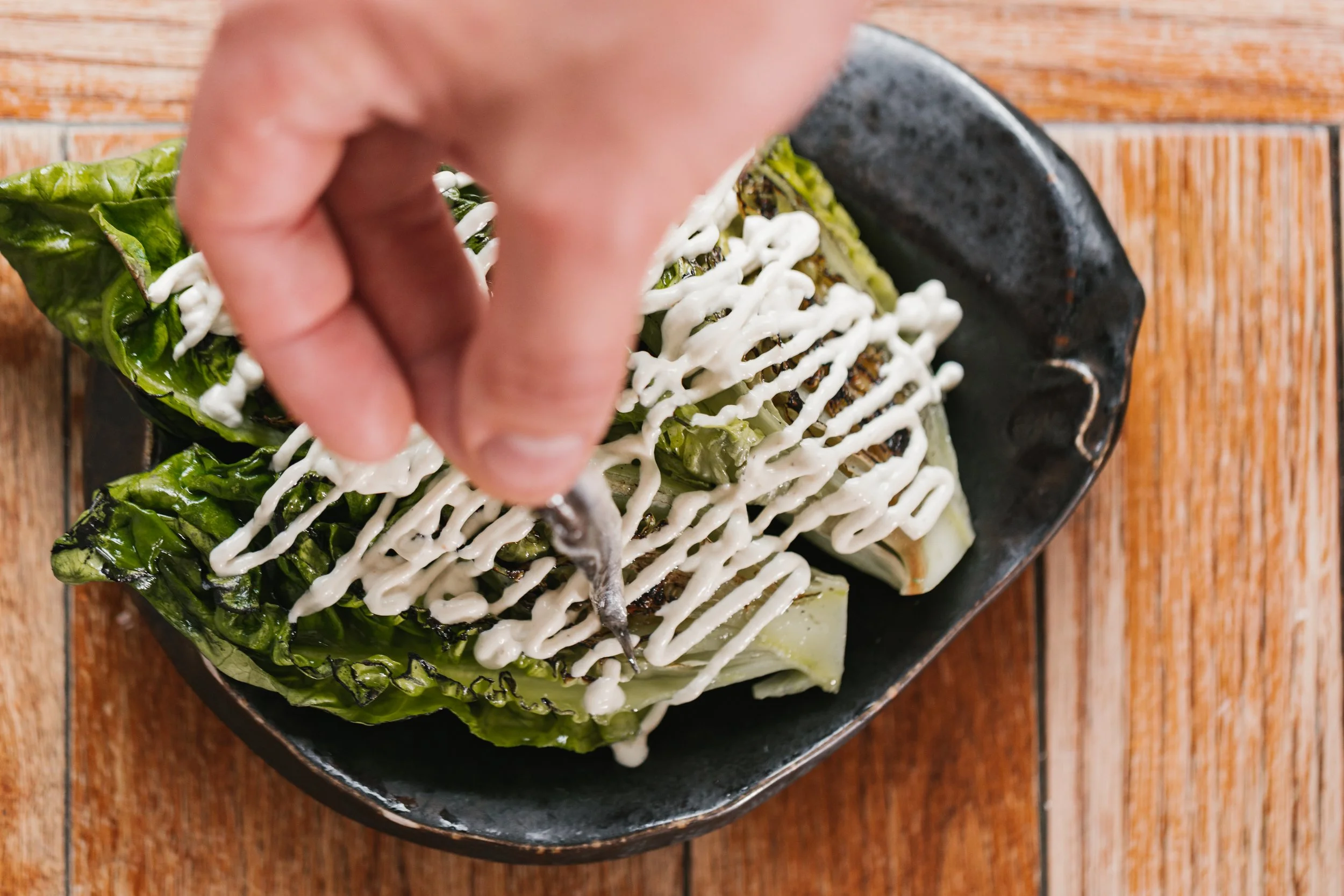 charred baby gem with anchovies and anchovy sauce