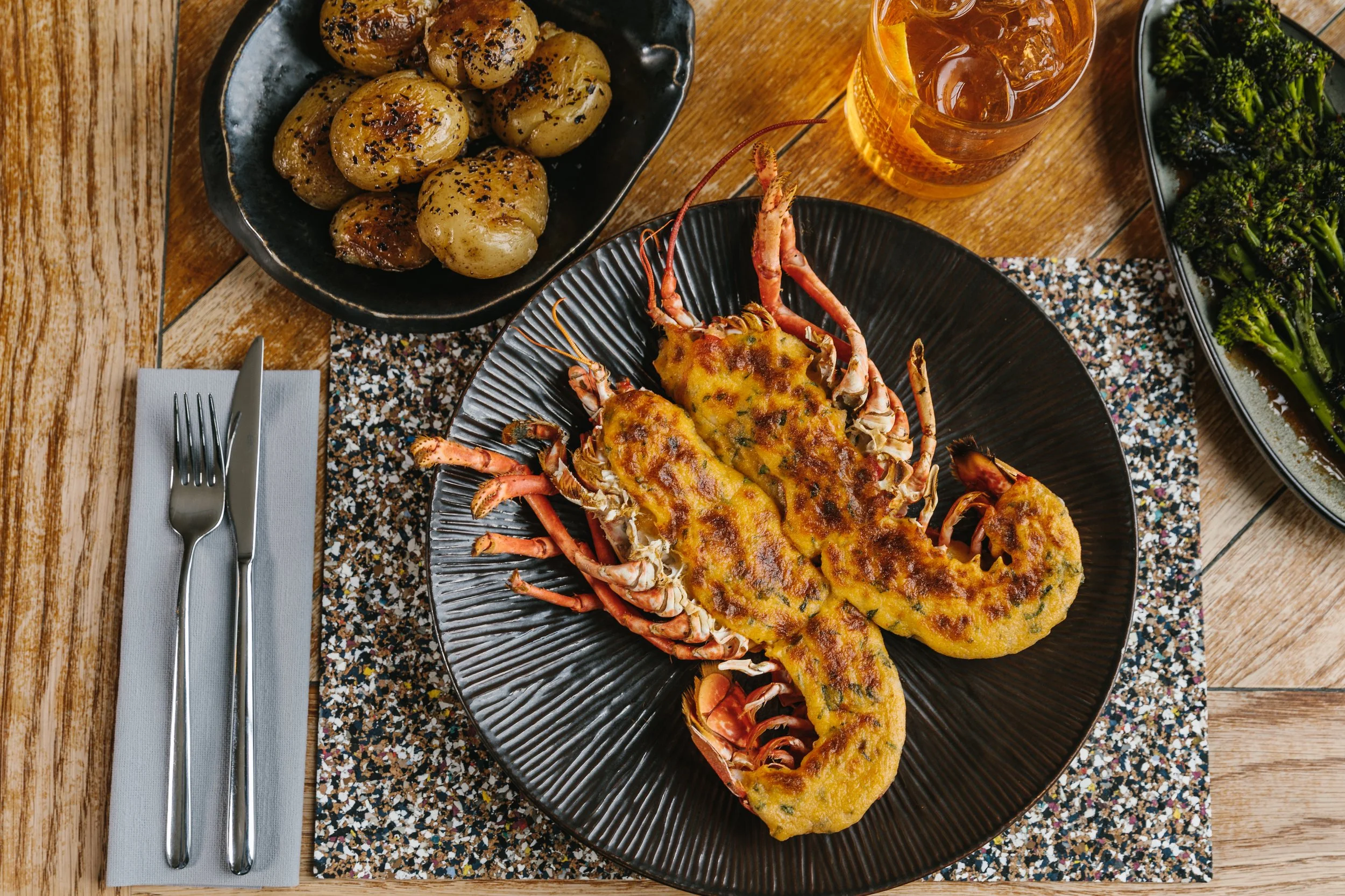 Lobster thermidor with potatoes and broccoli