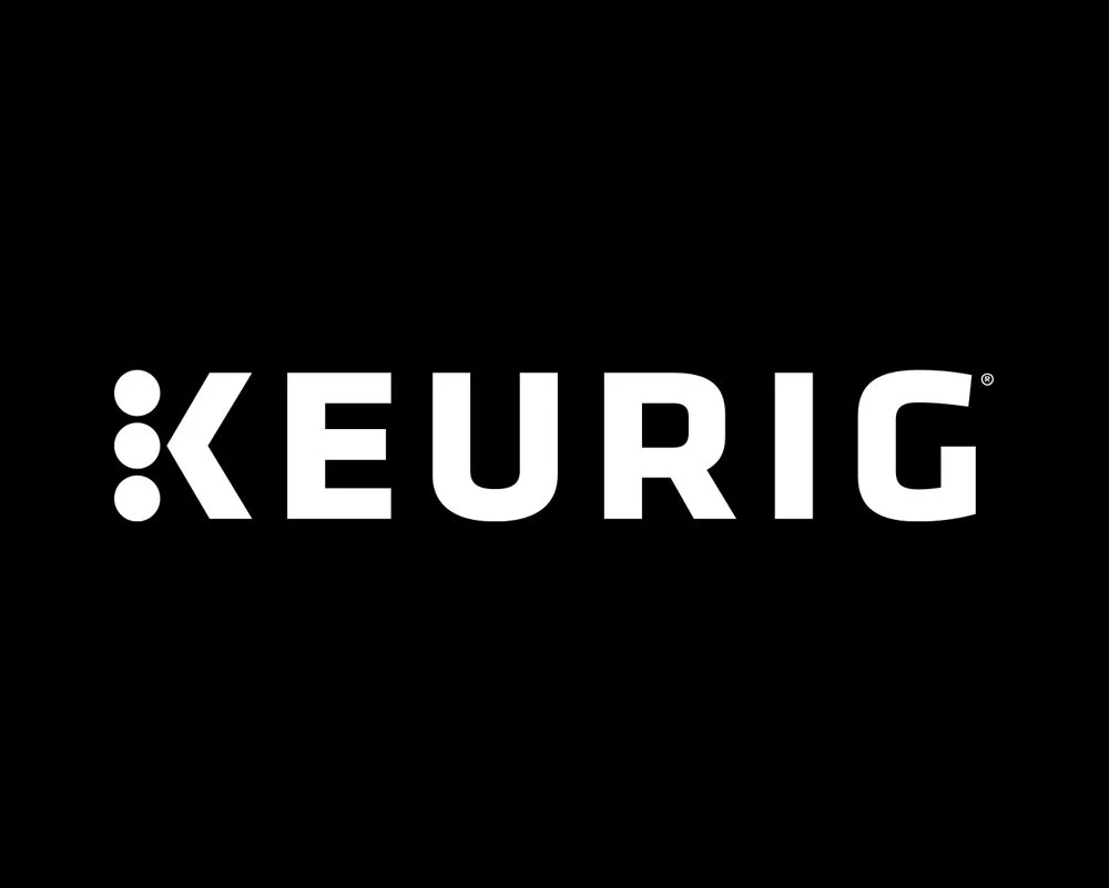 Logo of Keurig coffee machine brand in white on a black background.
