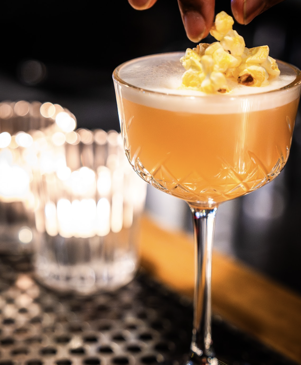 Cocktail being served at Little Red’s hidden bar in Melbourne CBD.