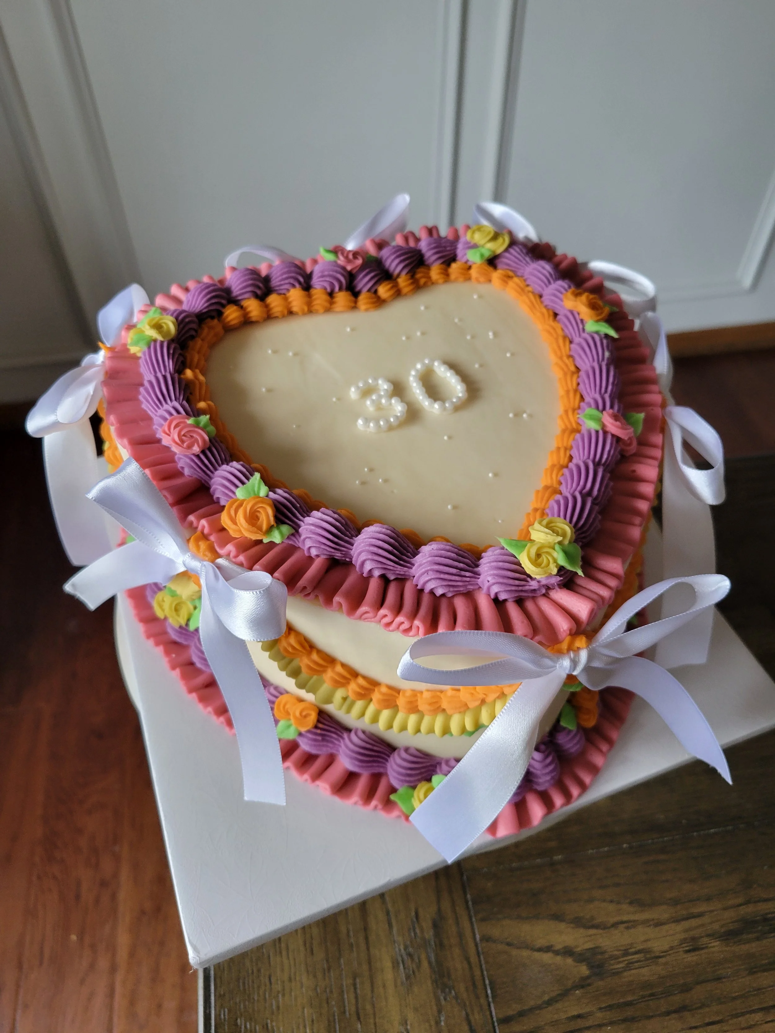 Custom celebration cakes in Rochester, MN for birthdays, anniversaries, graduations, and special occasions. Designed to match your vision and create a memorable centerpiece.