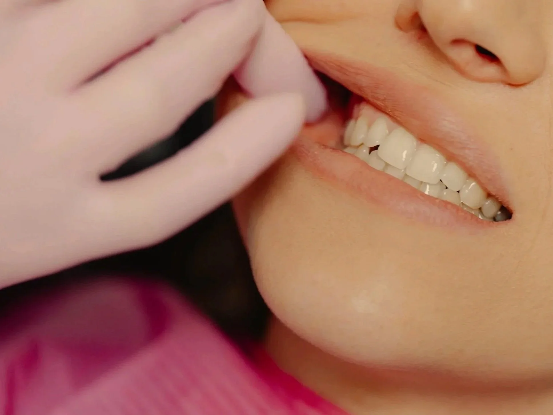 A Massage Therapist wearing gloves massaging the jaw muscles in the mouth. Intraoral Massage for TMJ