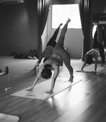 Women practicing intentional movement during a wellness class.