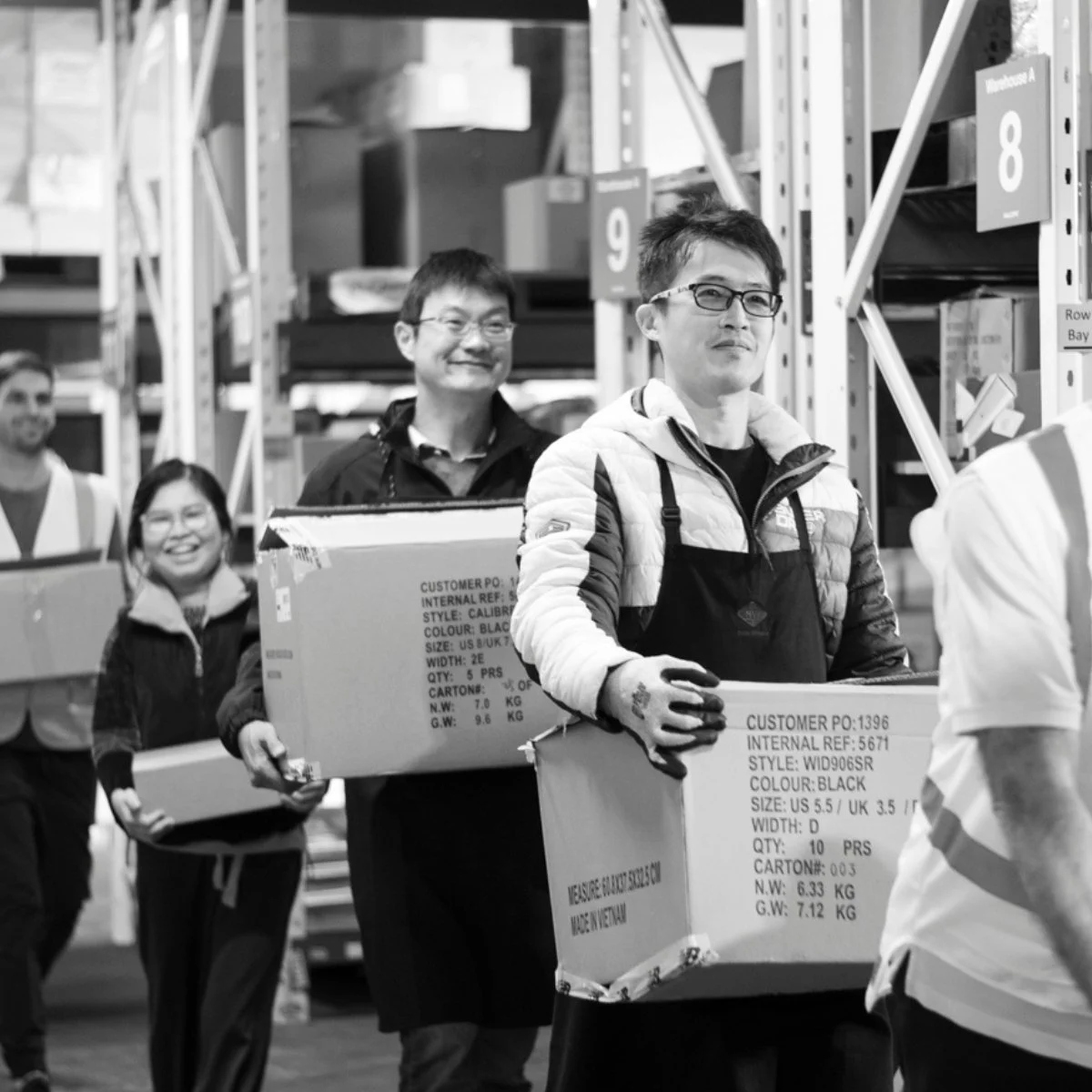 Malcove nz team carrying boxes of merchandise