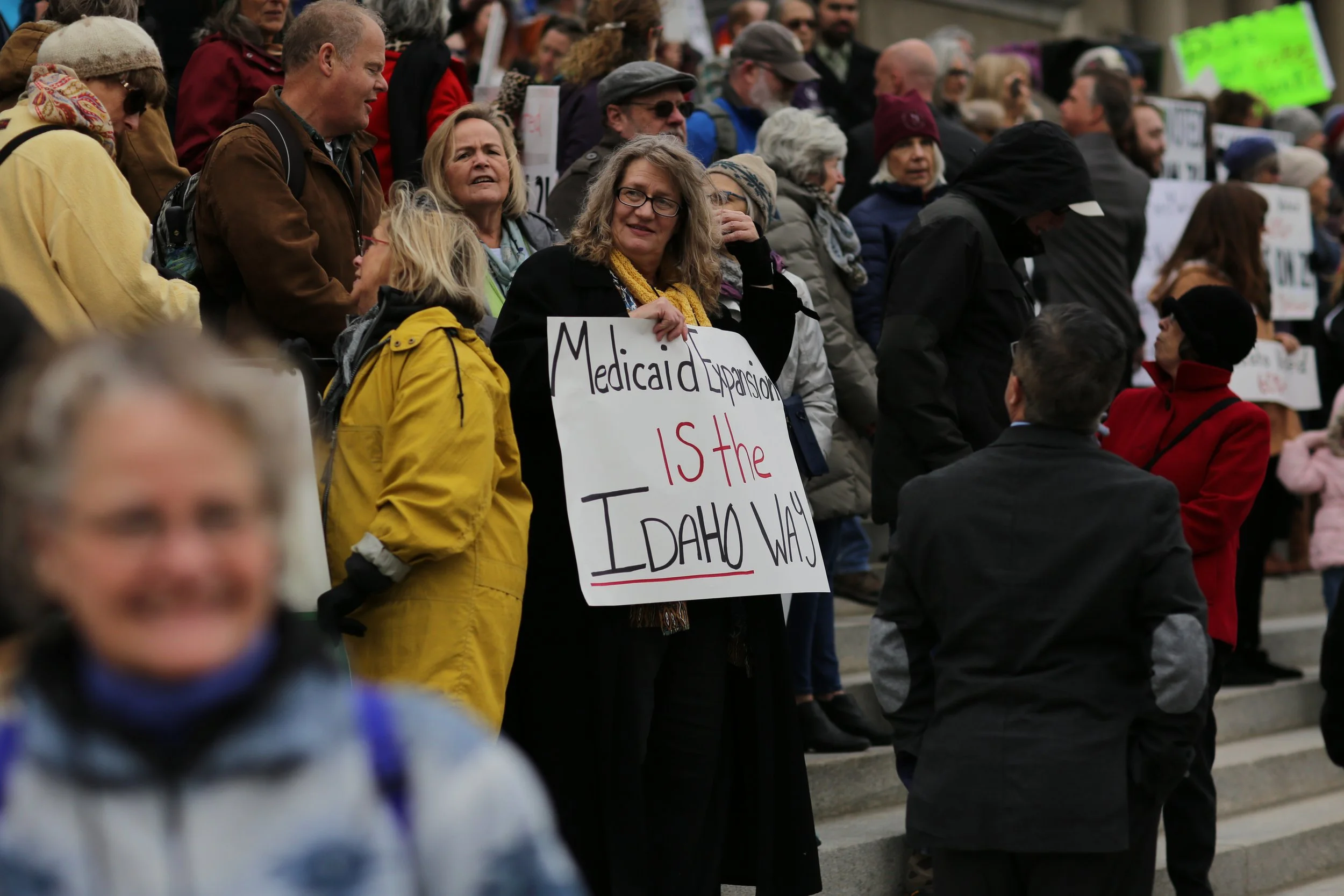 Woman Holding Protest Sign