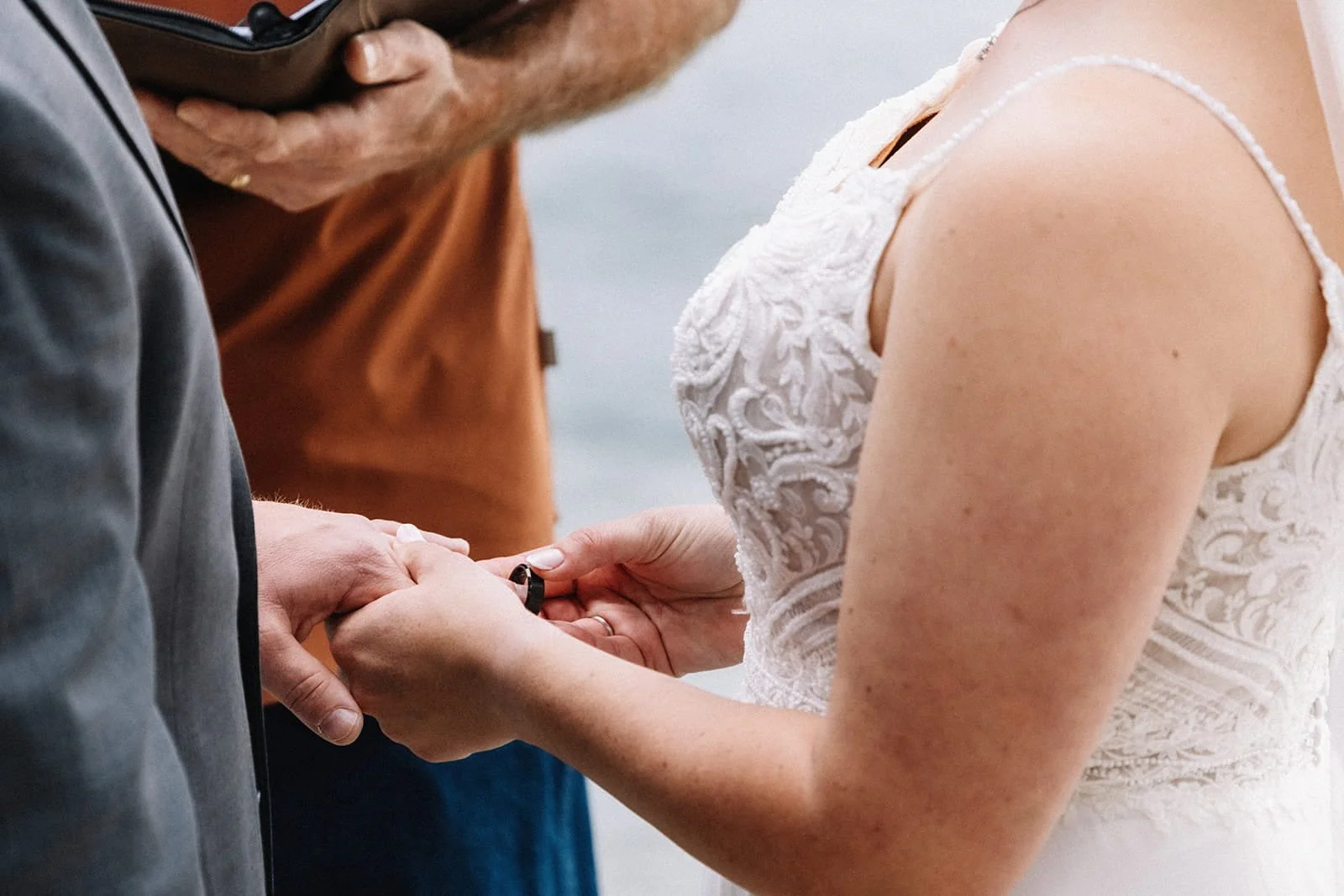 close up of ring exhange during elopement ceremony in lake tahoe.jpg