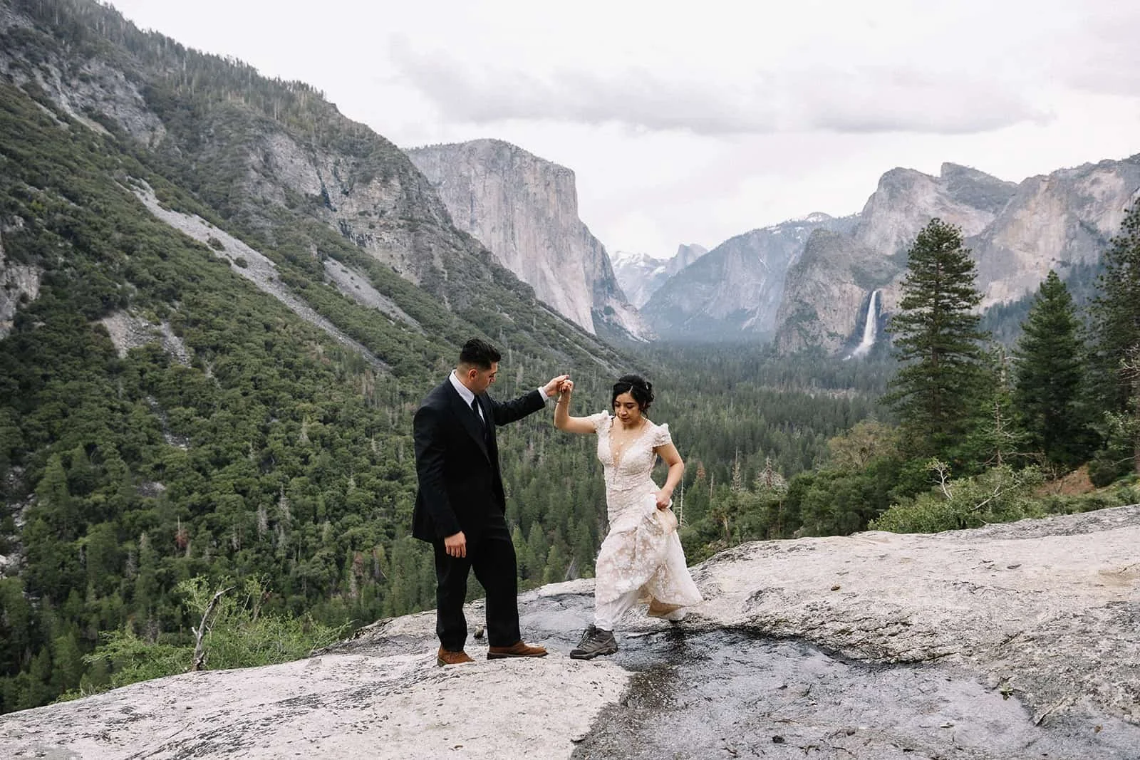 Couple standing together at Tunnel View overlooking Yosemite Valley