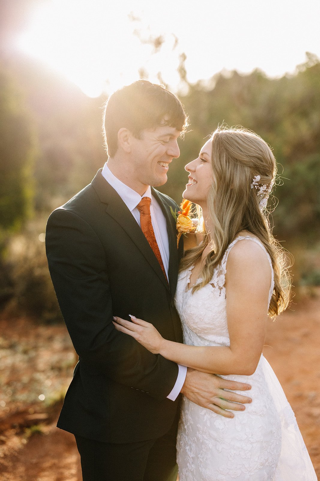 Couple at Bell Rock Sedona sunrise - Sedona elopement photographer AJ Photography