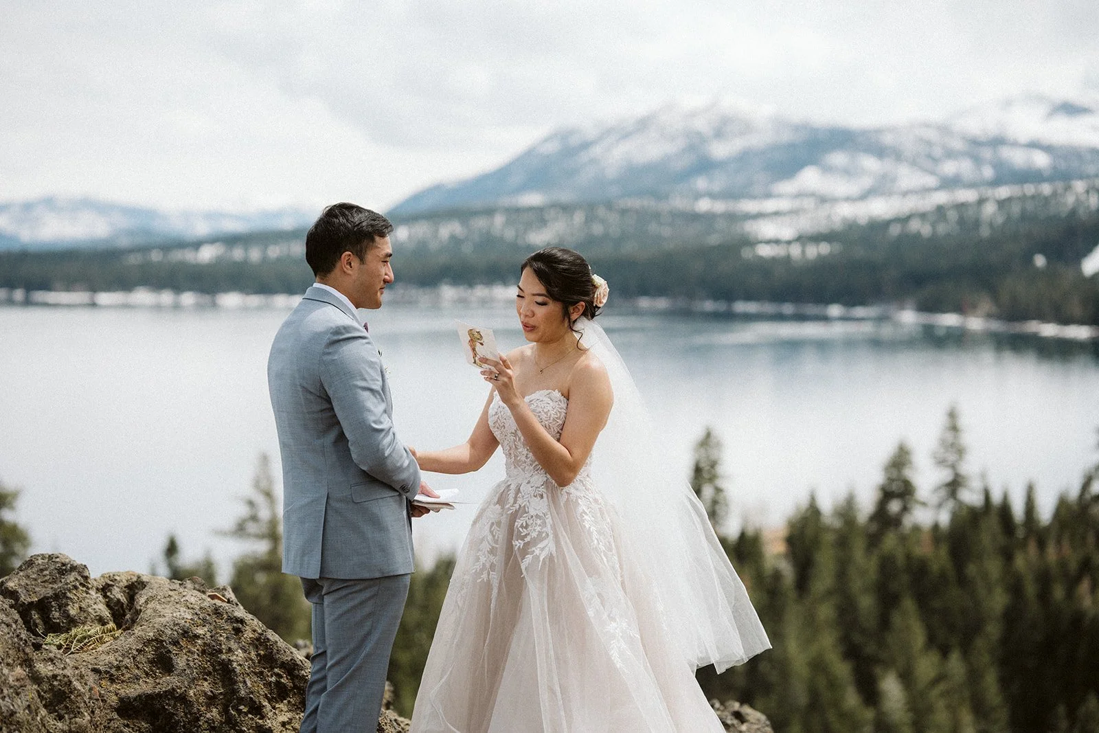 Bride and groom exchanging vows at Eagle Rock overlooking Lake Tahoe — AJ Photography