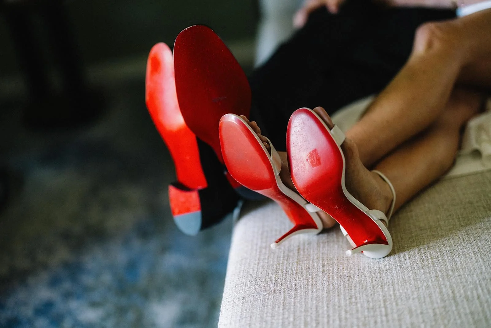Close-up of the bride's red shoes on the bed.jpg