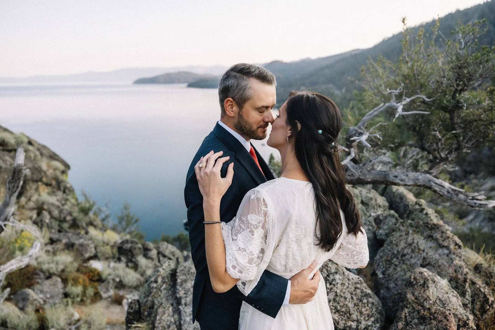 Couple at Cave Rock Lake Tahoe sunrise - Lake Tahoe elopement AJ Photography