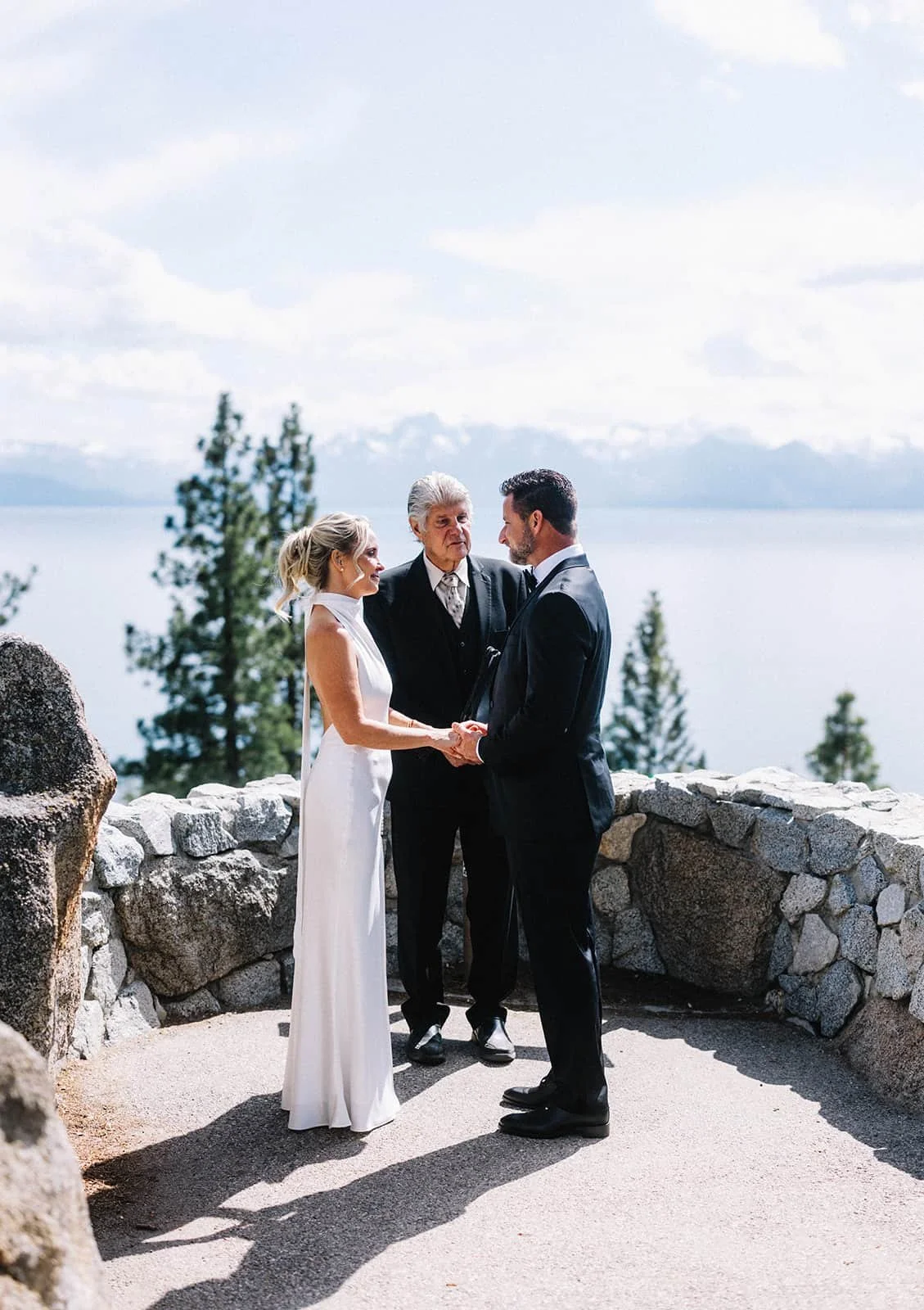 Bride and groom exchanging rings during their Logan Shoals ceremony.jpg