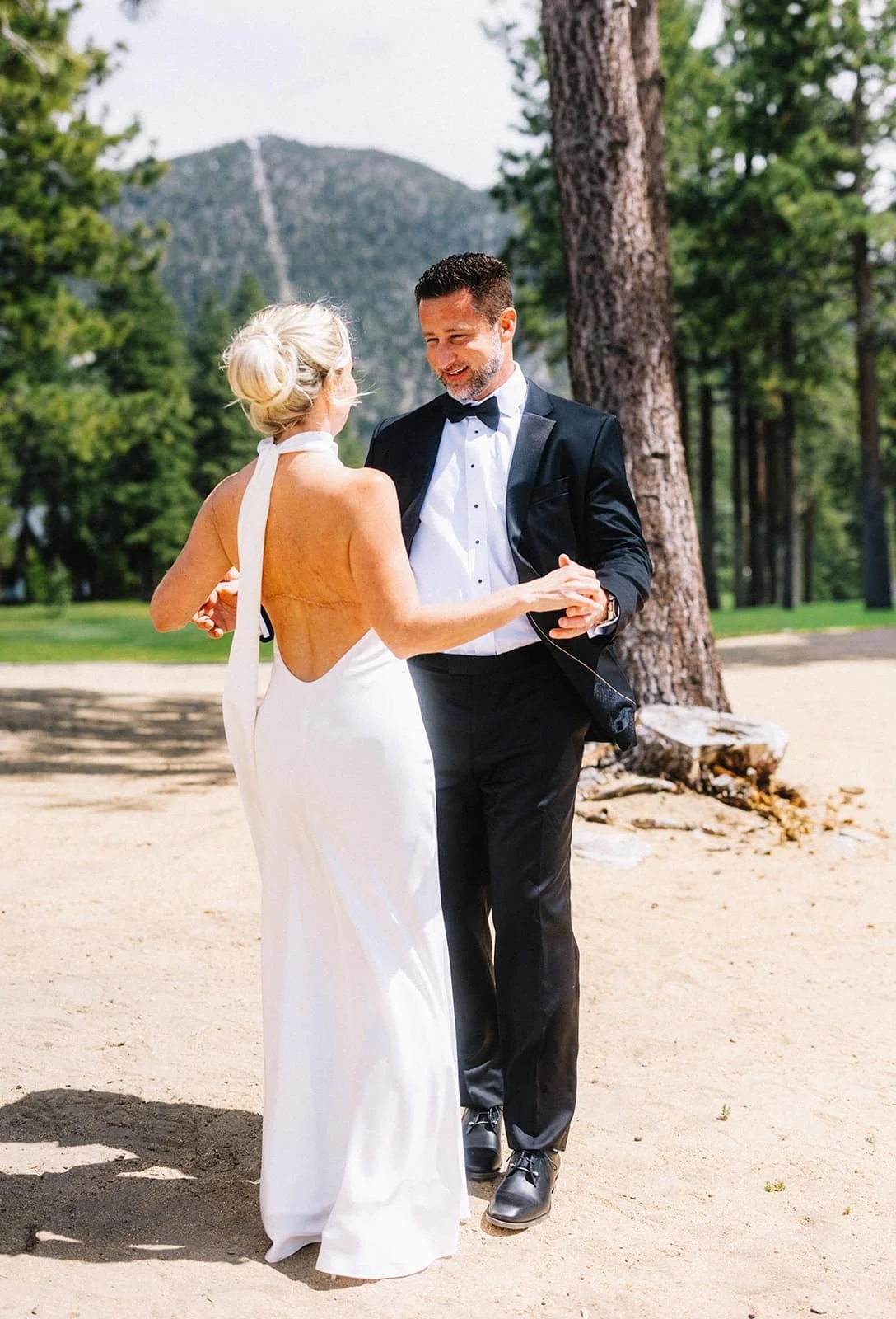 bride and grooms first look on Lake Tahoe beach.jpg