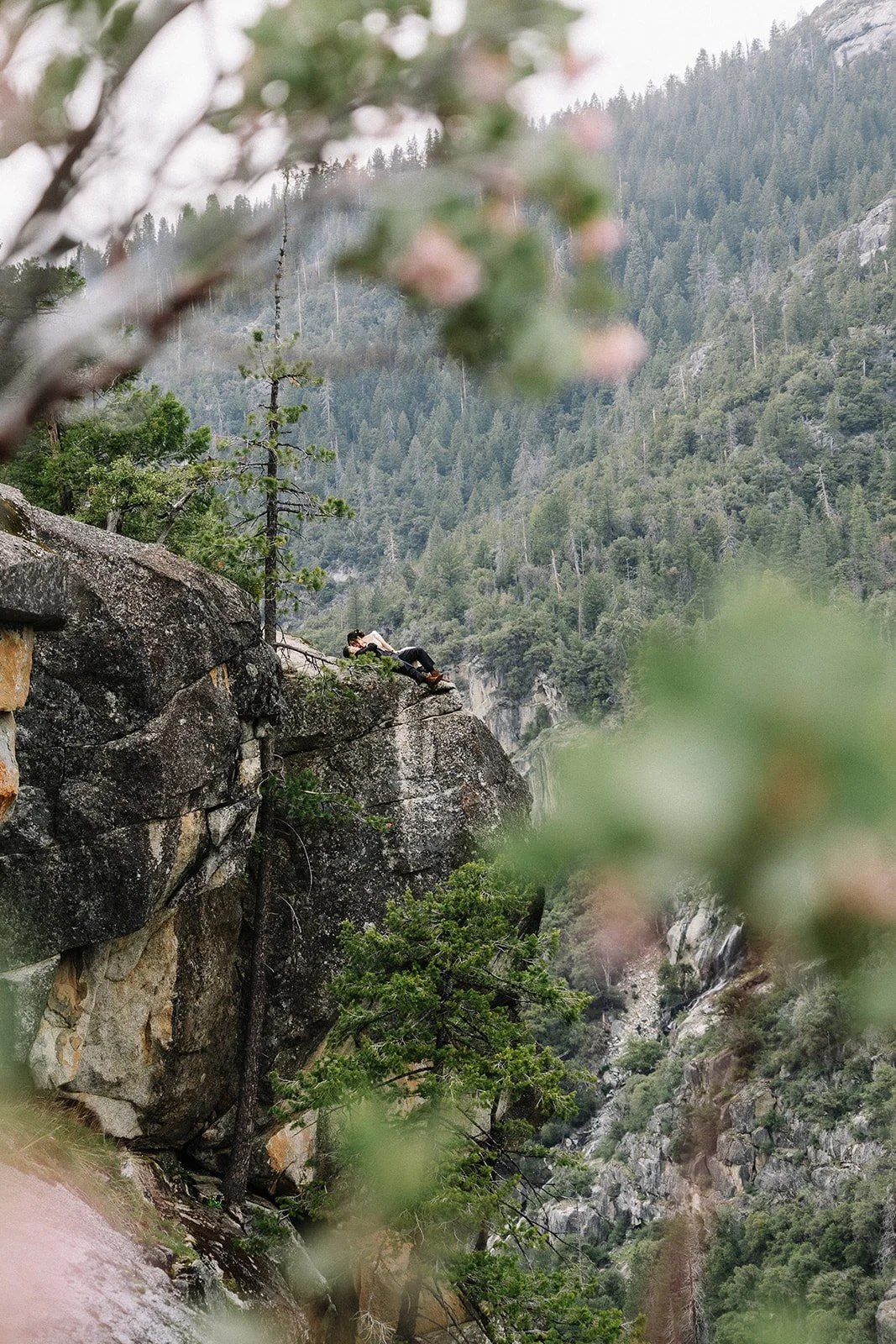 Couple on rocky ledge during Yosemite National Park elopement portraits — AJ Photography