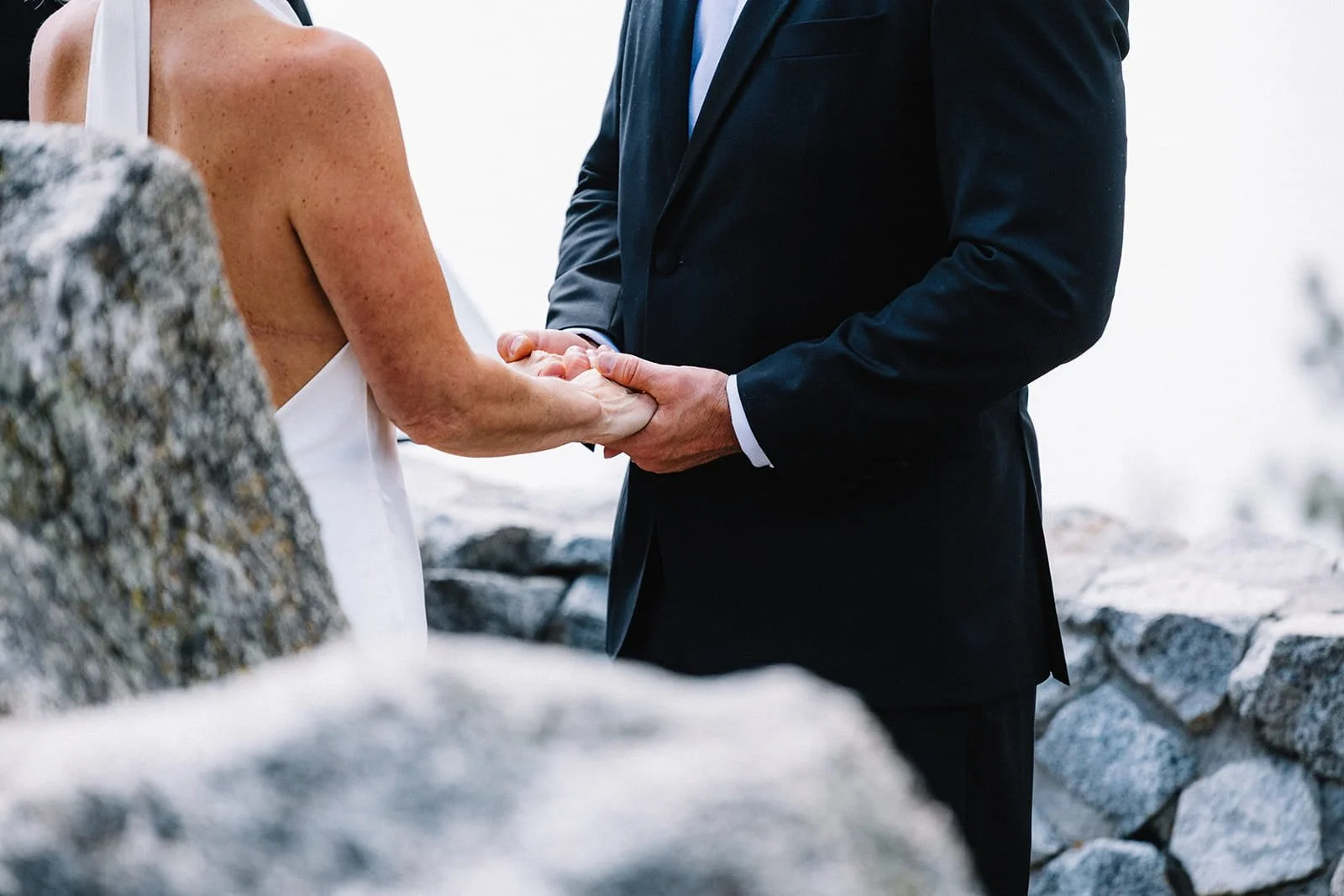 bride and groom close up of hand holding during ceremony.jpg