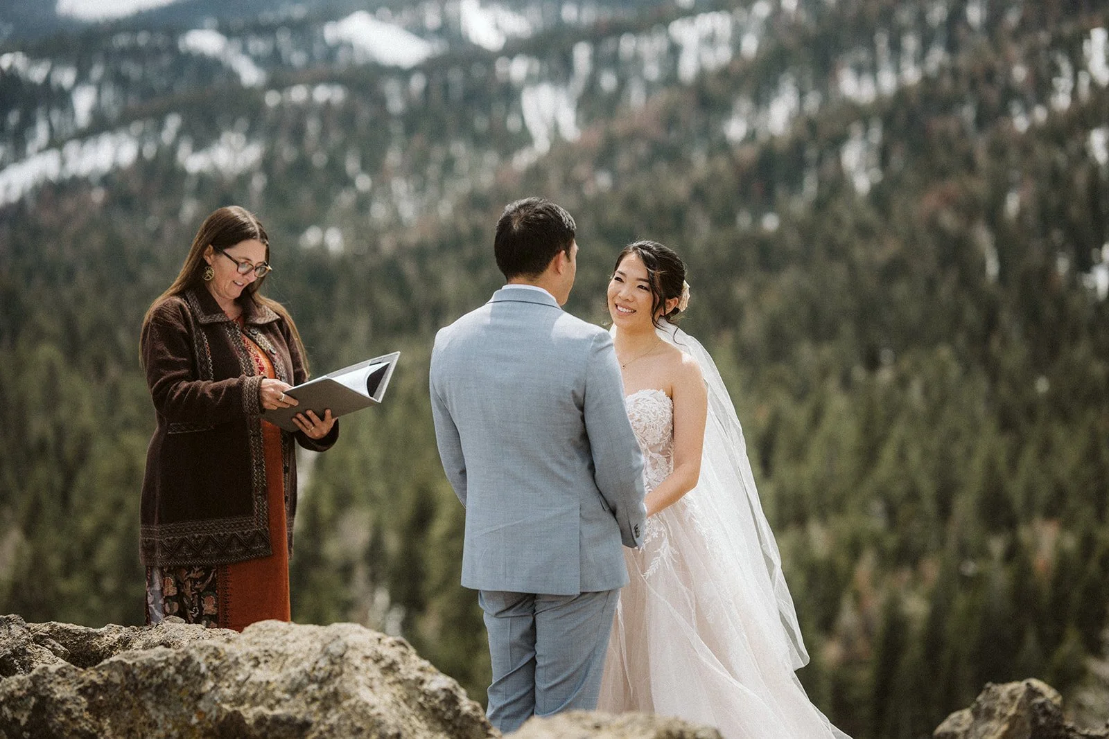 Bride and groom exchanging vows at Eagle Rock, Lake Tahoe elopement ceremony — AJ Photography