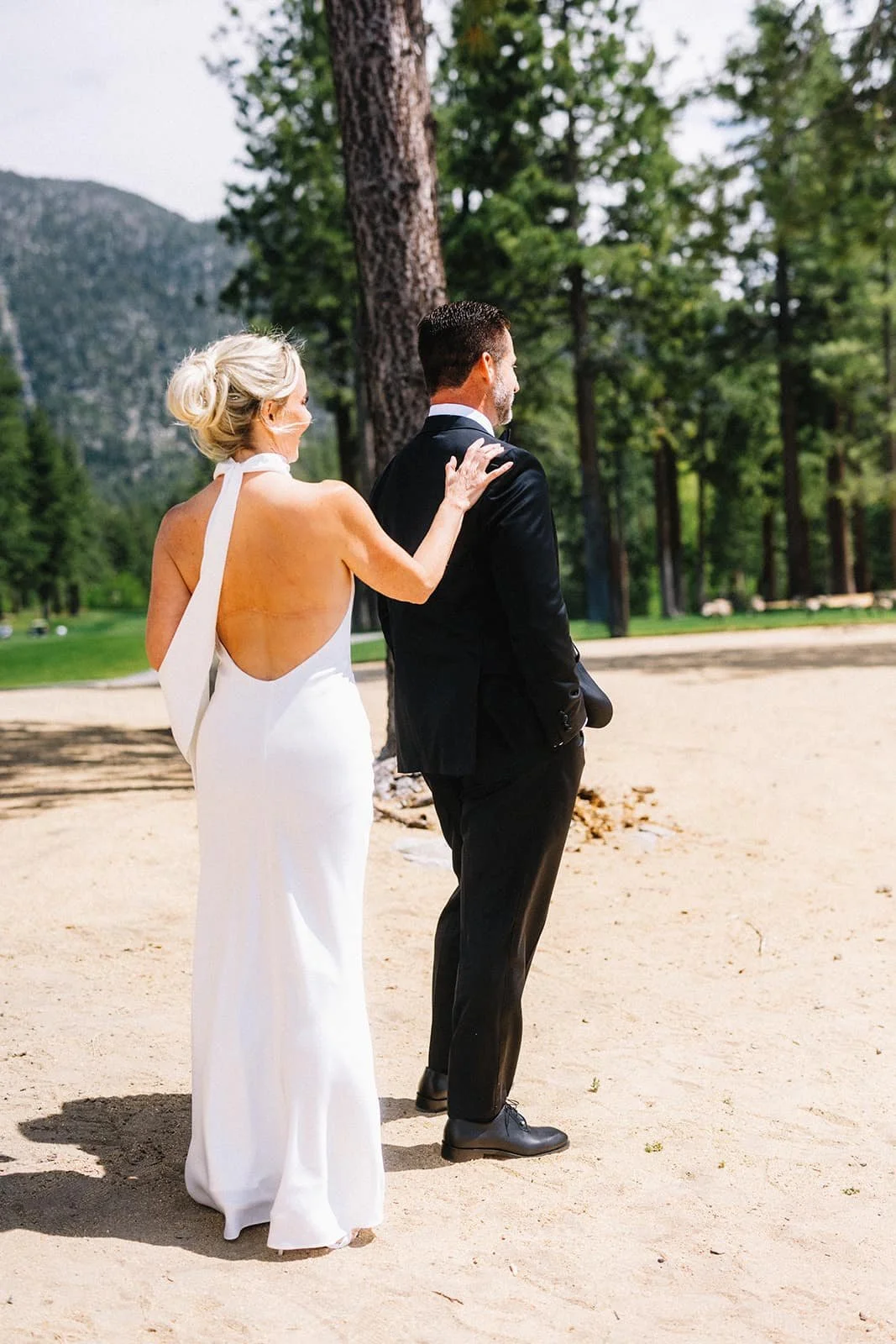 bride tapping groom on shoulder for first look.jpg