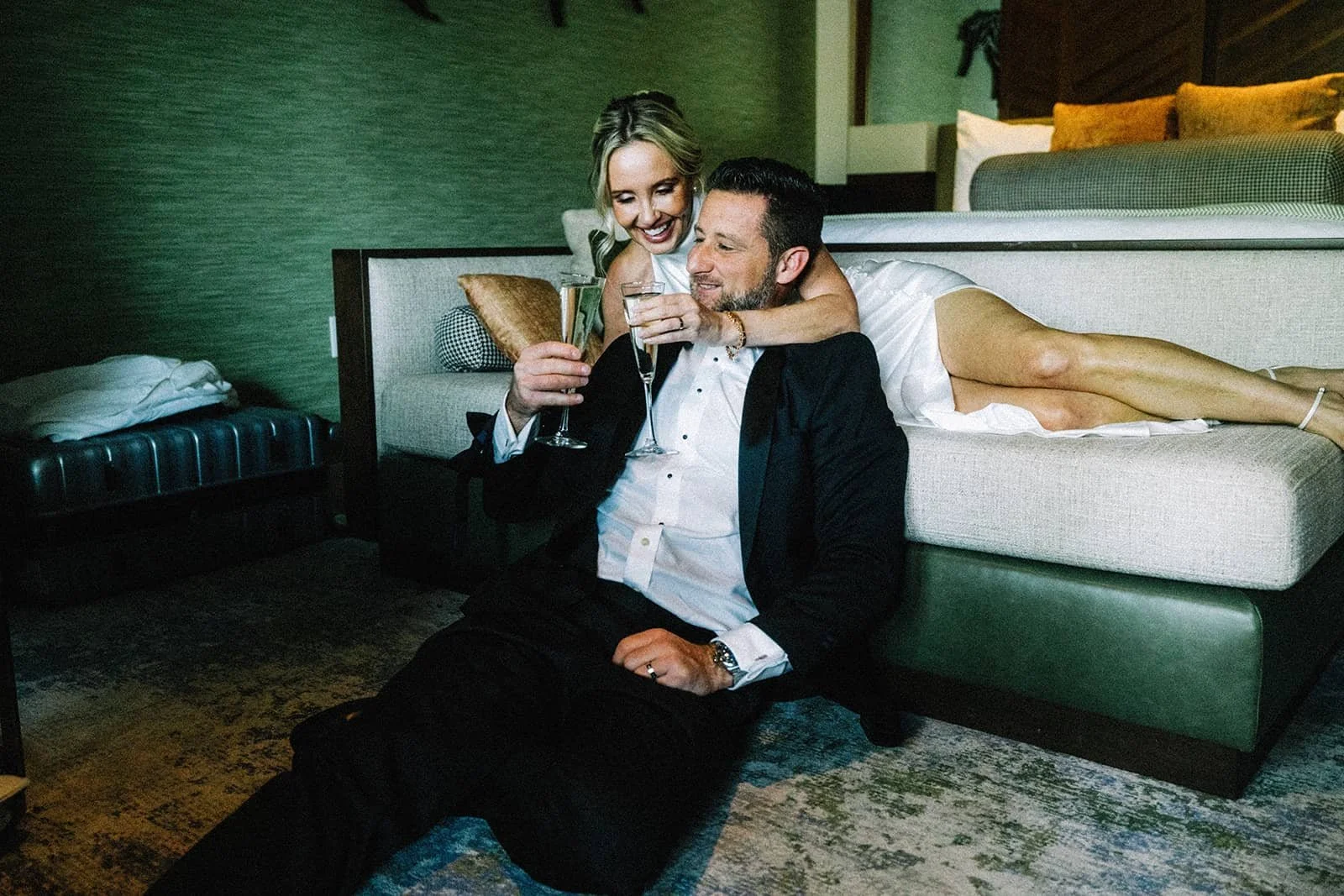 Bride and groom celebrating their Lake Tahoe elopement with champagne