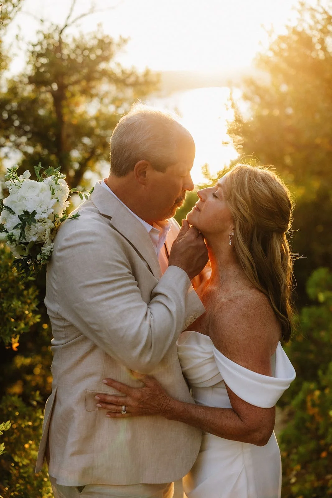 bride and groom on beach for sunset in Lake Tahoe