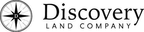 Discovery Land Company logo featuring a compass rose symbol and the words 'Discovery Land Company'.
